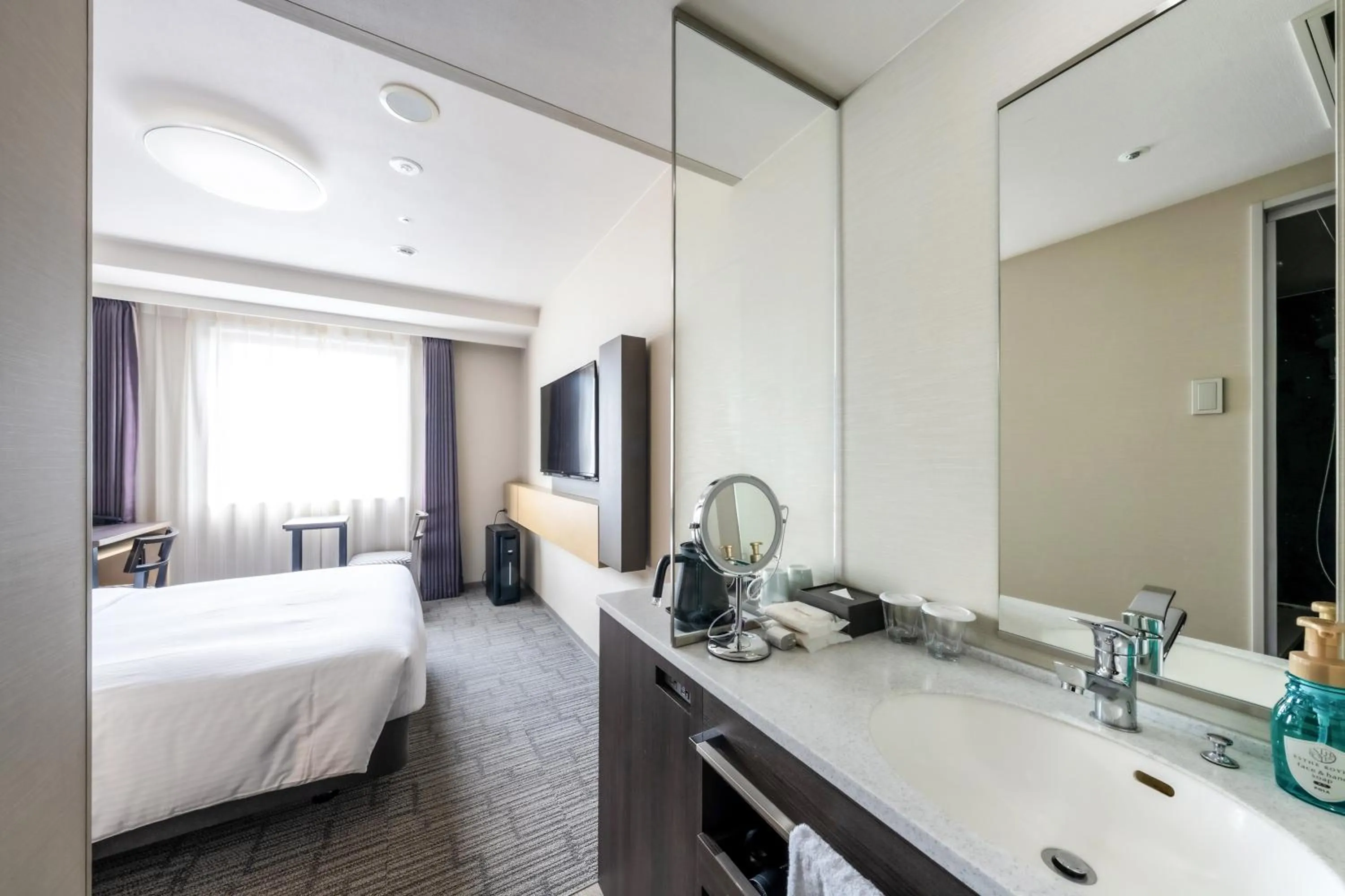 Bed in Richmond Hotel Yokohama Ekimae