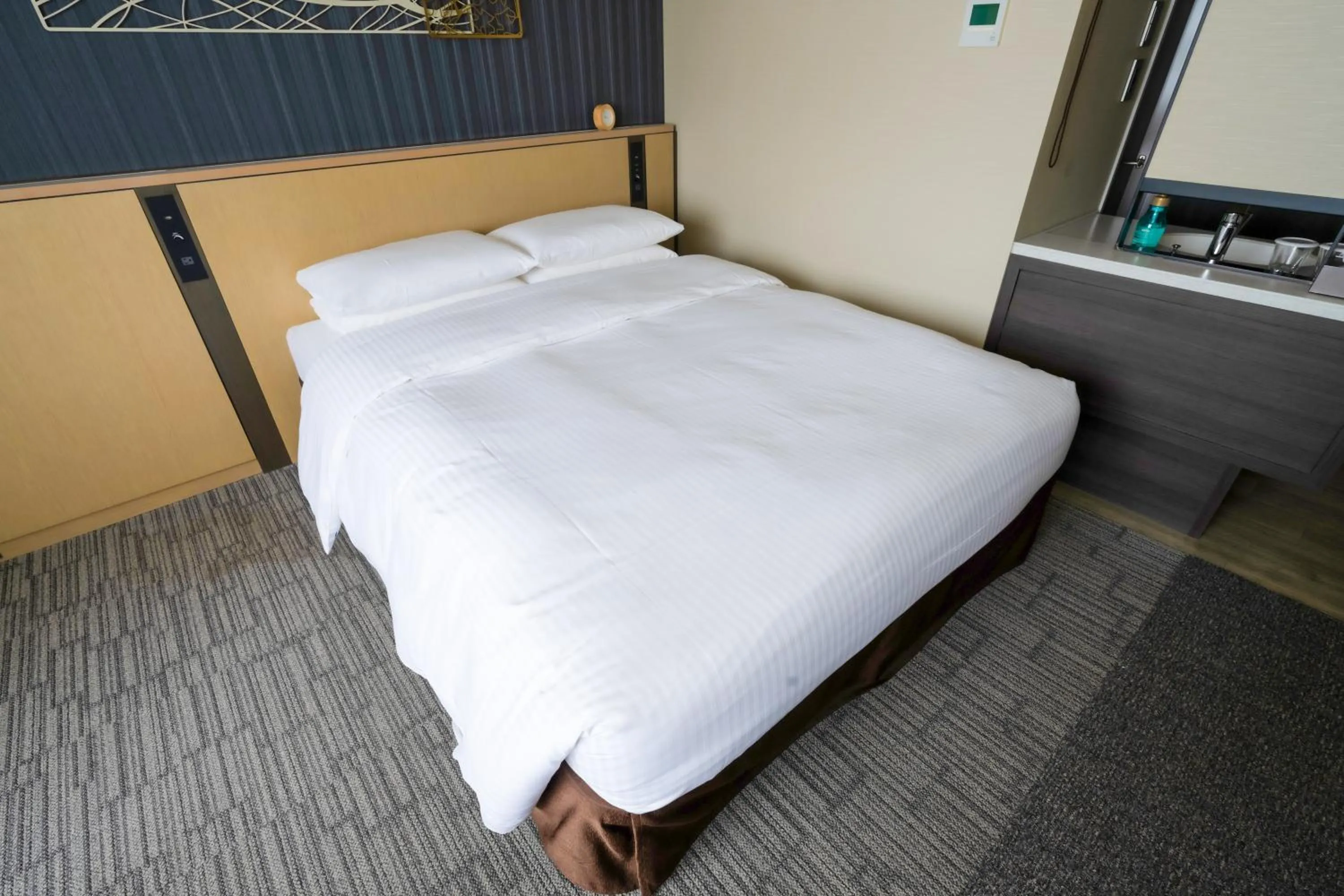 Bed in Richmond Hotel Yokohama Ekimae