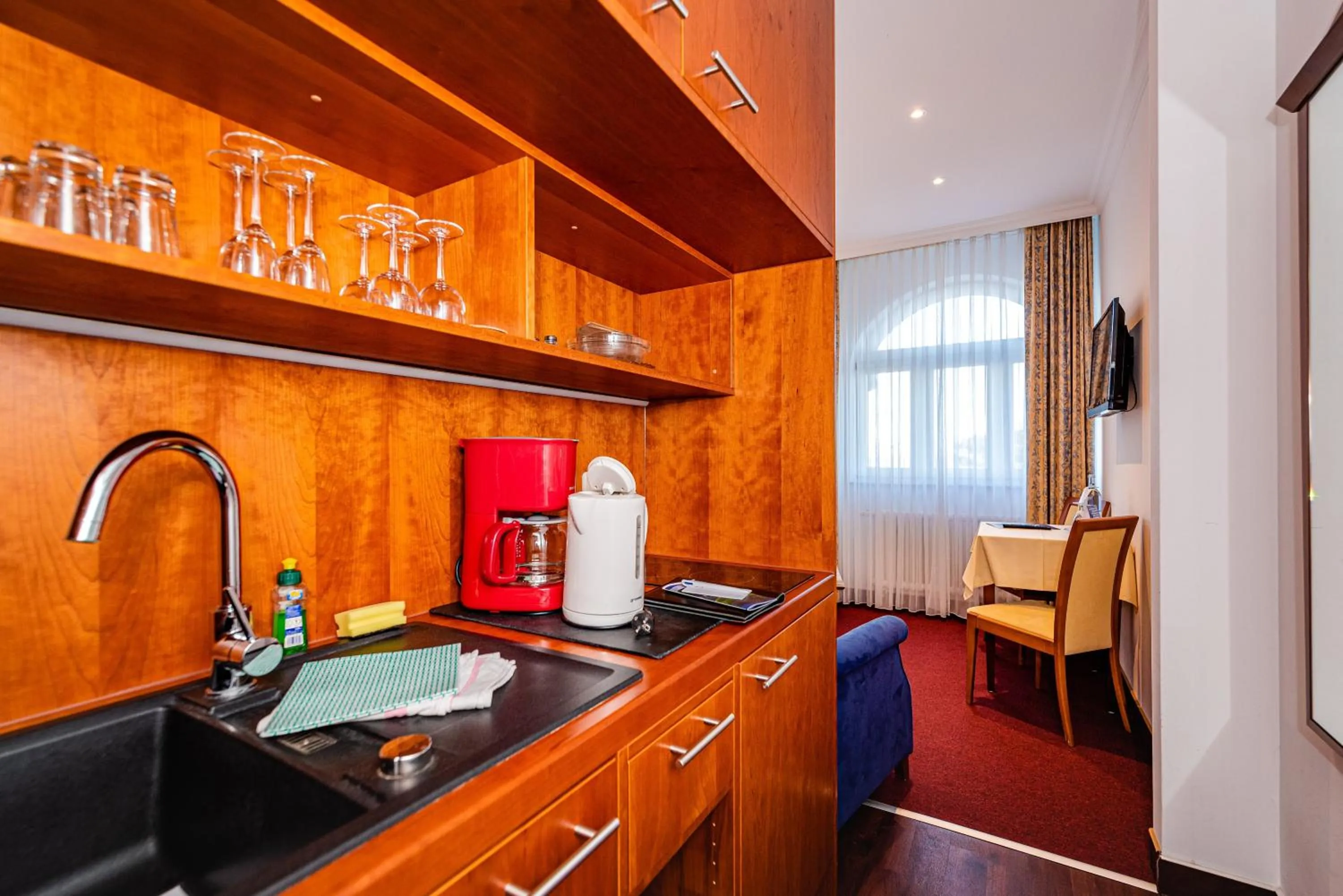 Kitchen or kitchenette in Aparthotel Seeschlösschen