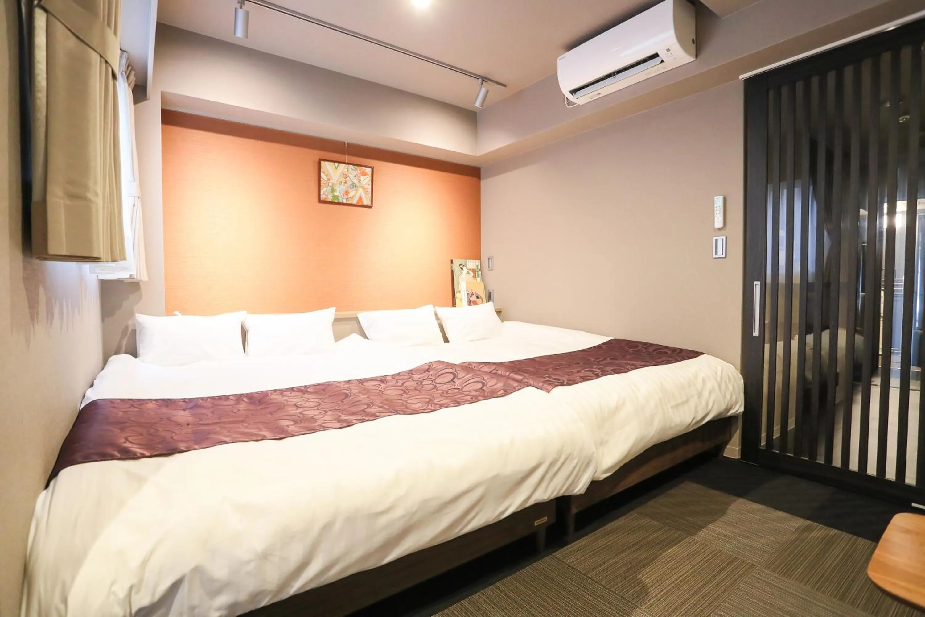 Bed in Apartment Hotel 7key S Kyoto