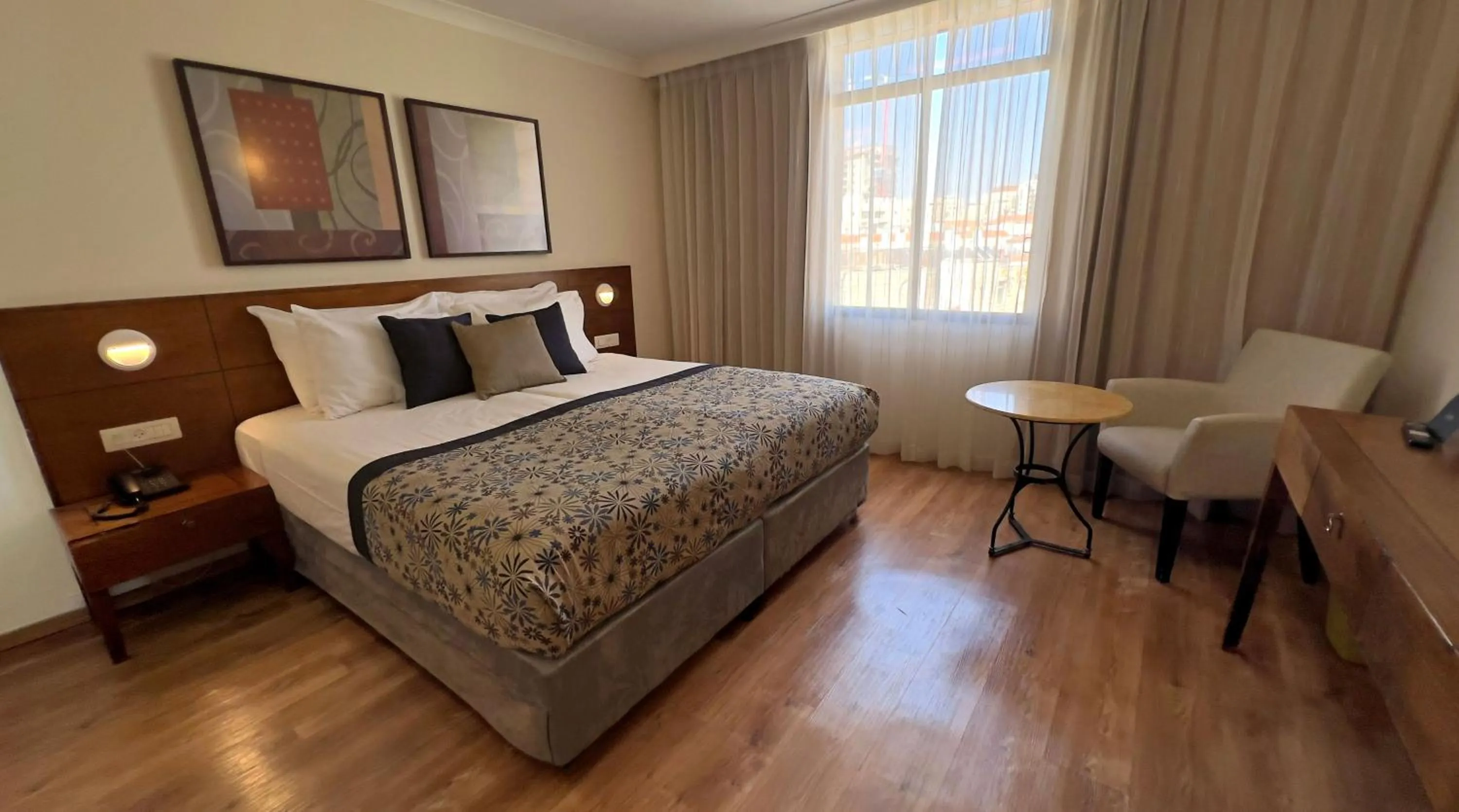 Bed in Caesar Premier Jerusalem Hotel