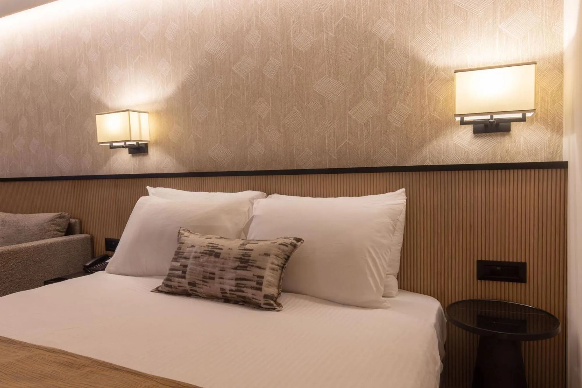 Bed in Caesar Premier Jerusalem Hotel