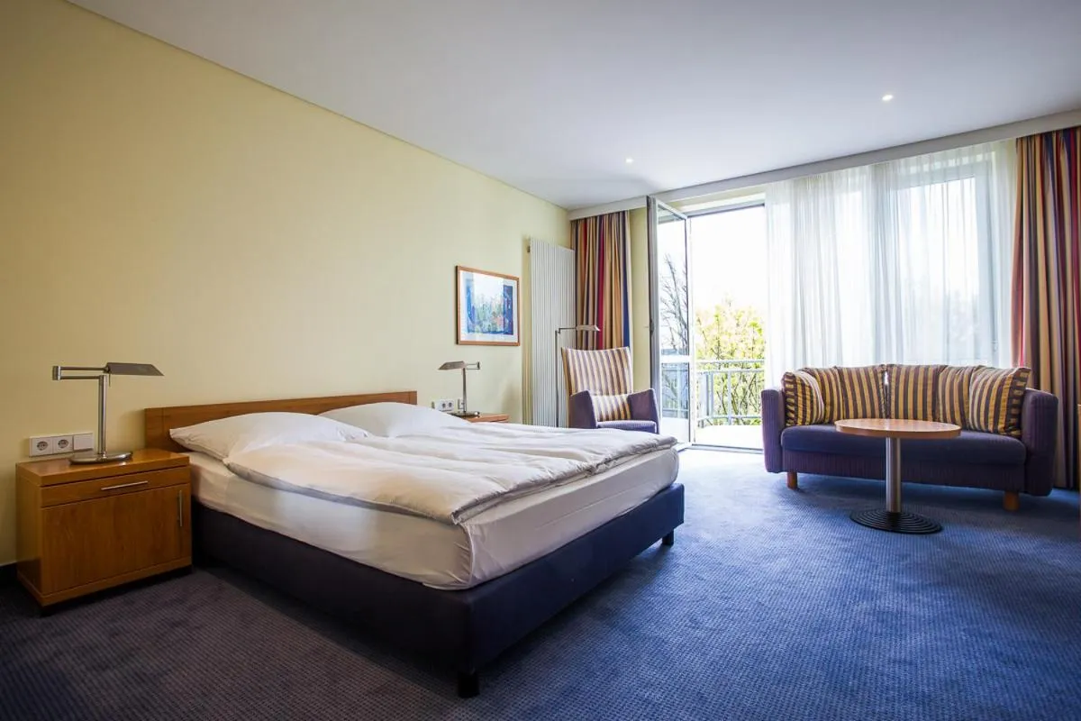 Living room, Bed in Aparion Apartments Berlin