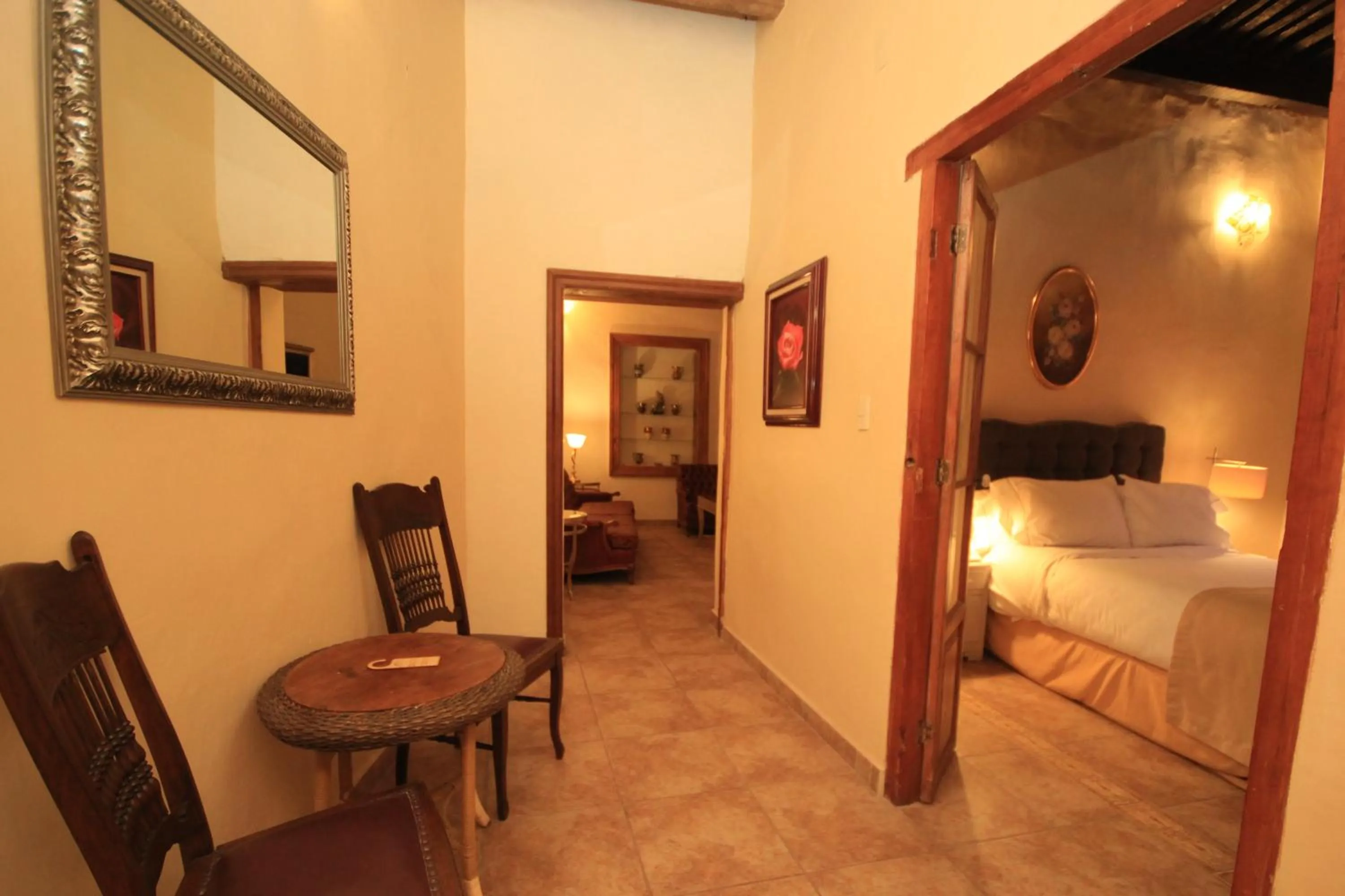 Communal lounge/ TV room, Bed in Hotel Boutique Ponciano