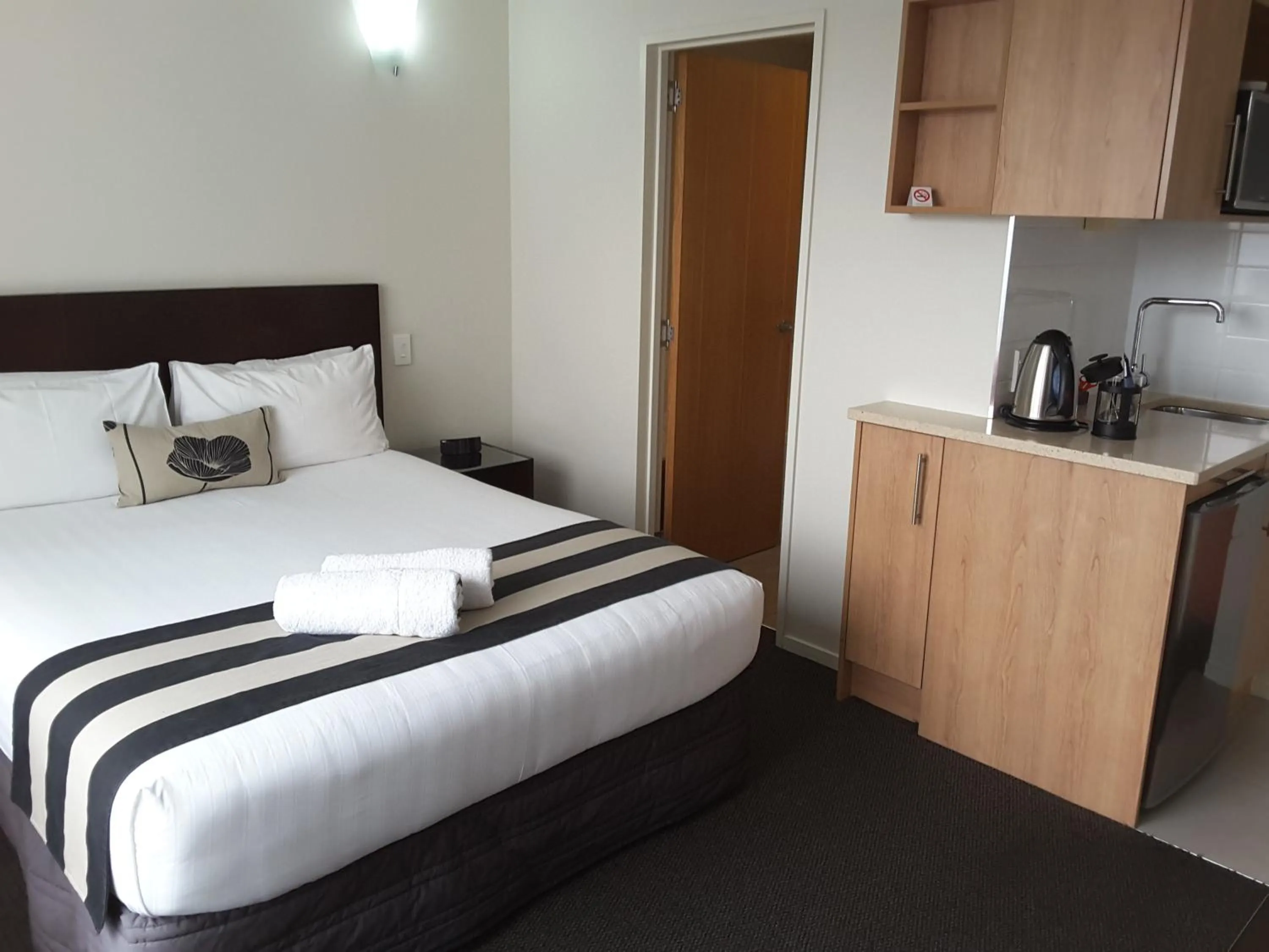 Photo of the whole room, Bed in Focus Motel