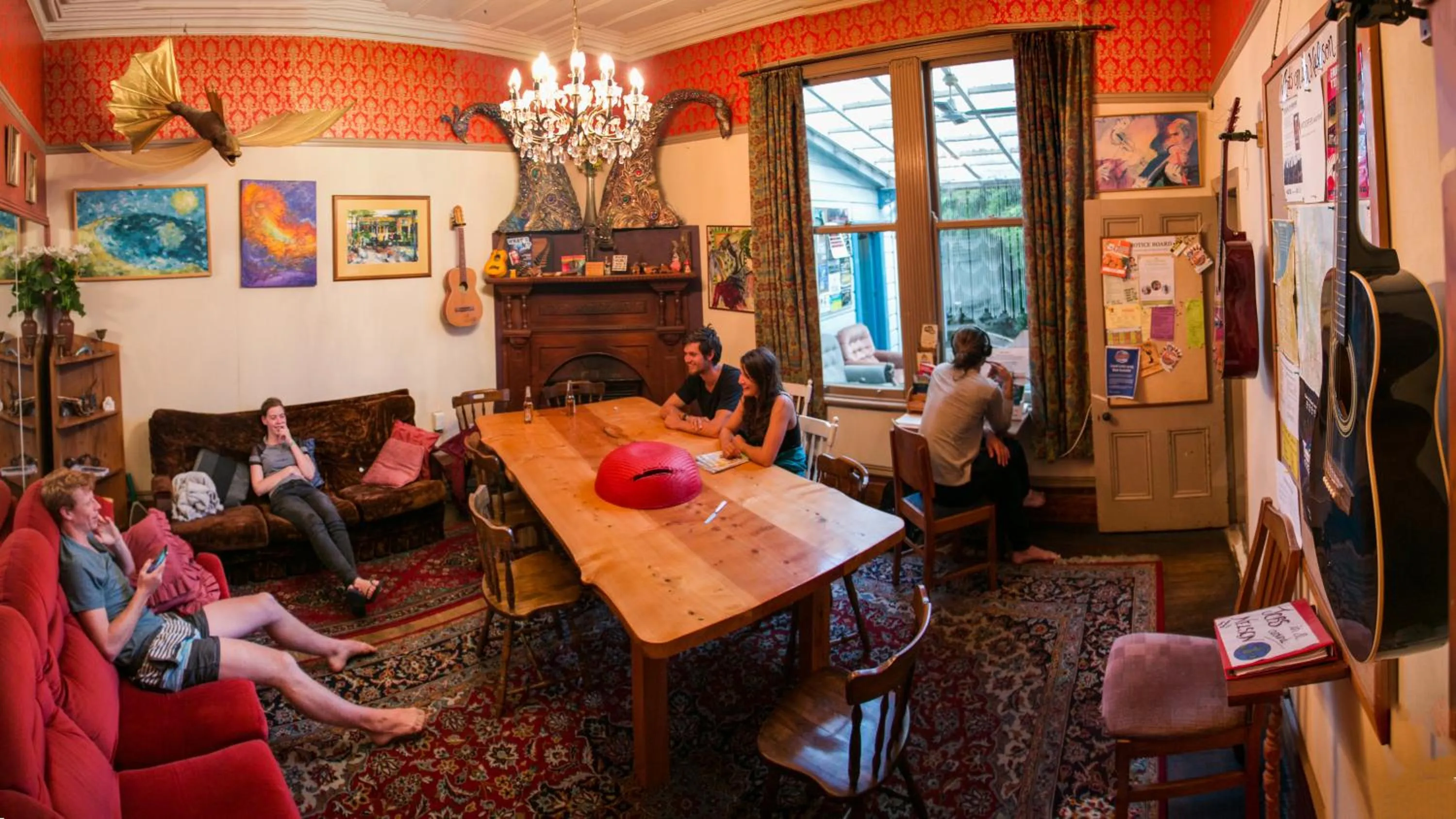 Communal lounge/ TV room in The Palace Backpackers