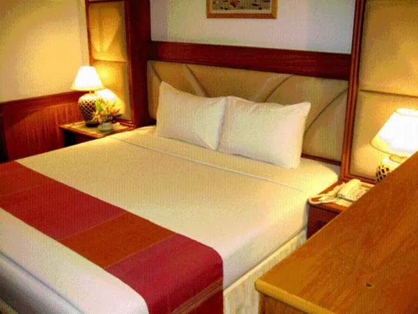 Bed in Raya Grand Hotel