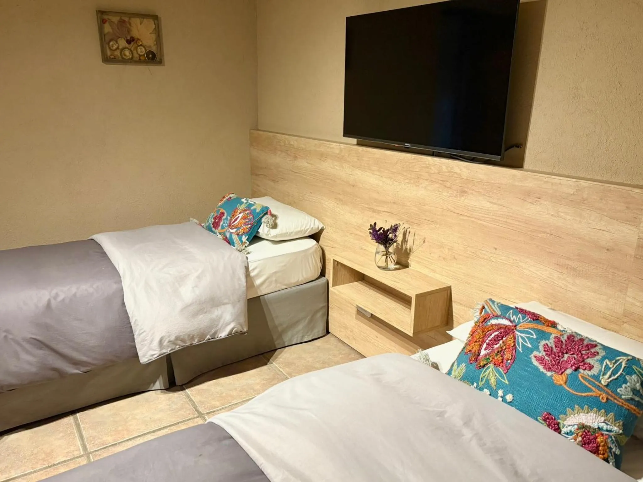 Bed in Le Bouquet Apart Hotel