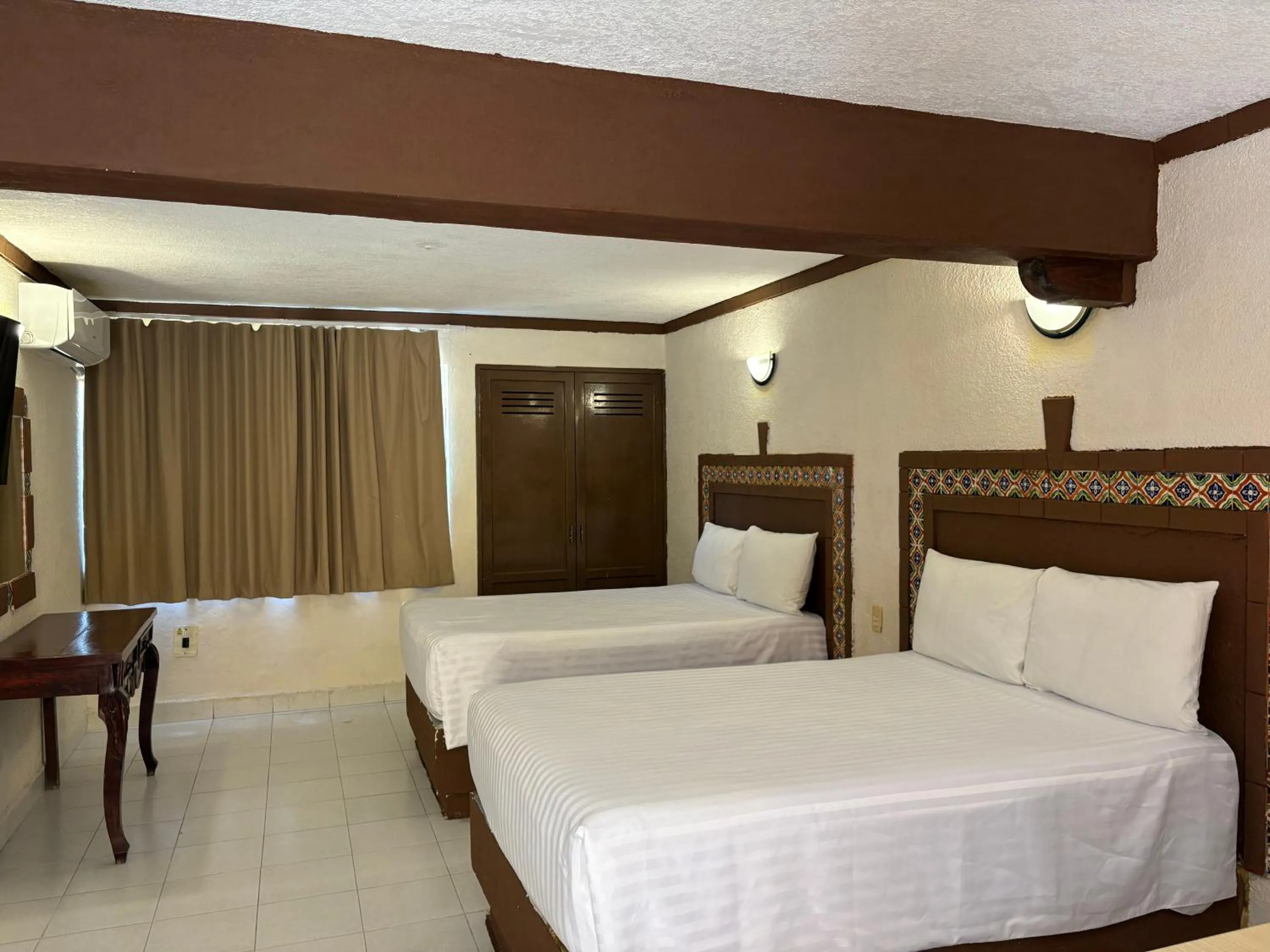 Bed in Suites Cancun Center