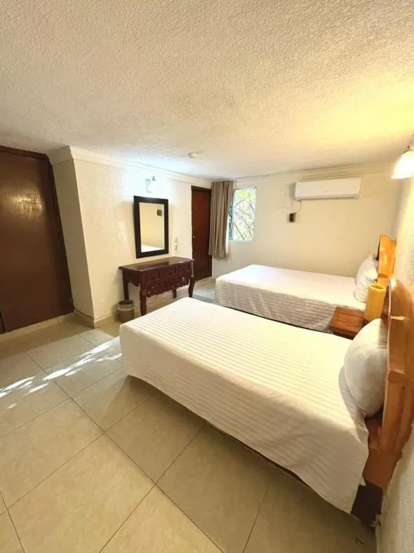 Bed in Suites Cancun Center