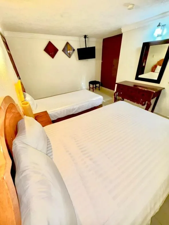 Bed in Suites Cancun Center