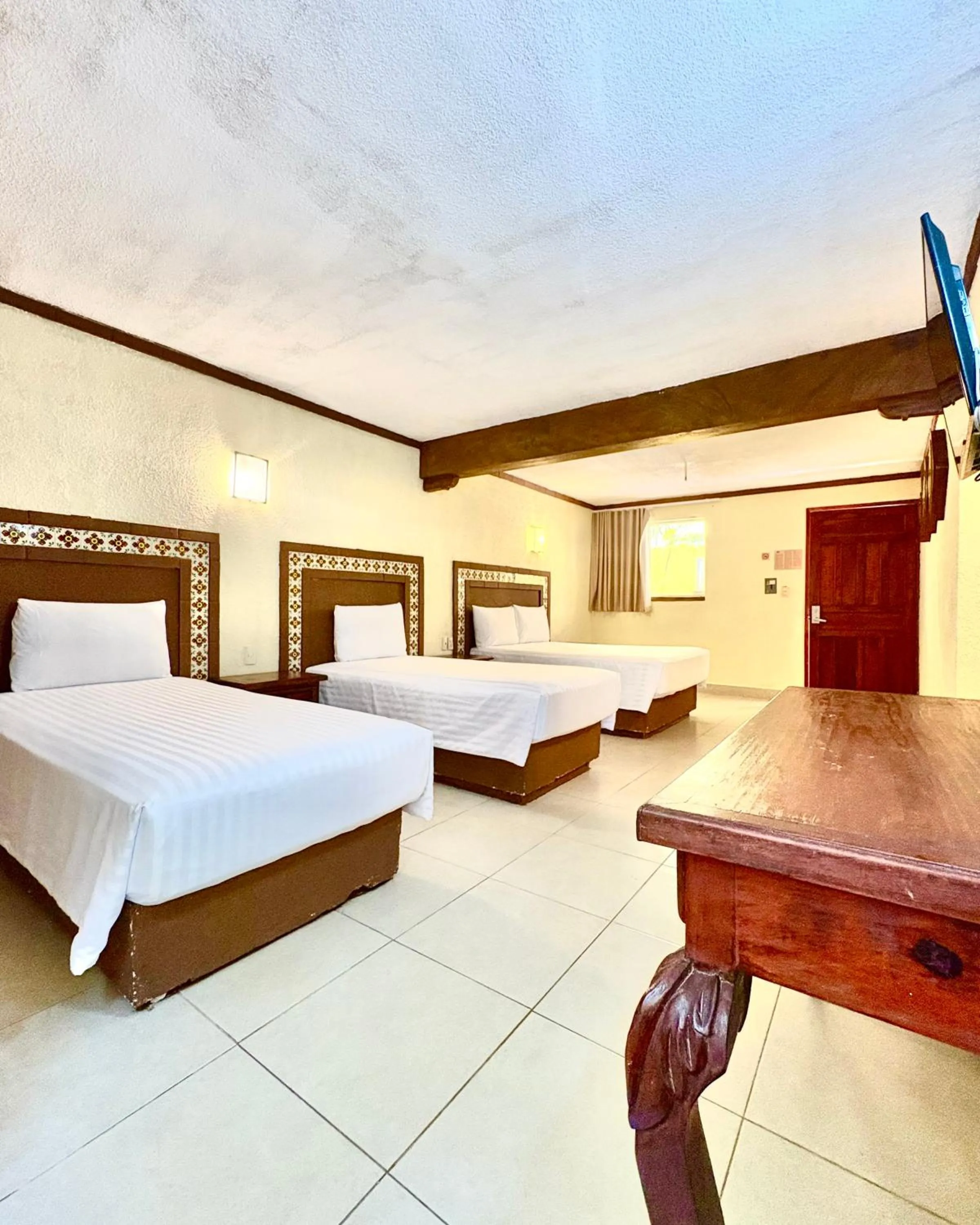 Bed in Suites Cancun Center