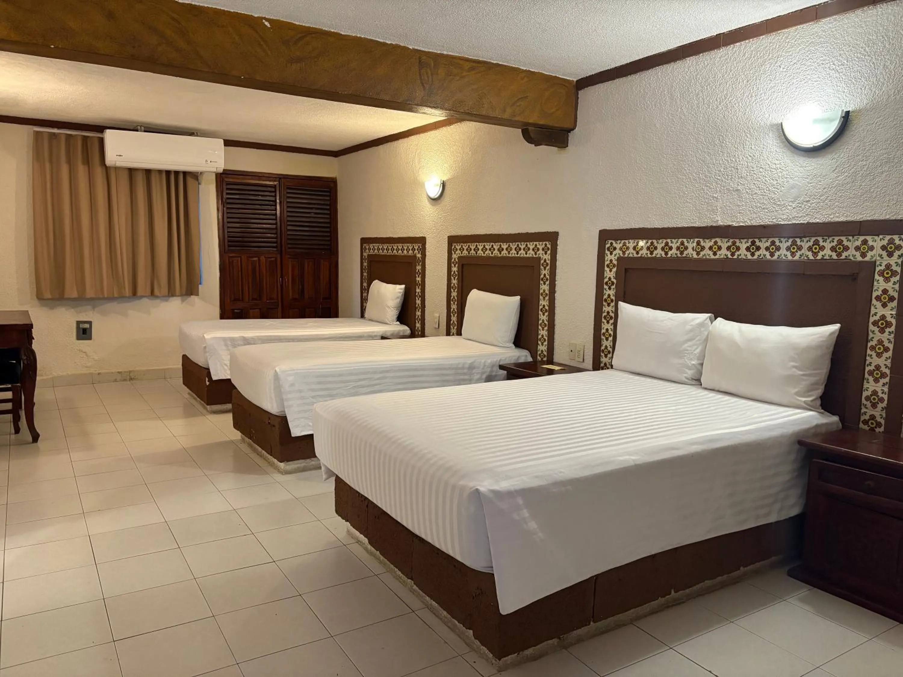 Bed in Suites Cancun Center