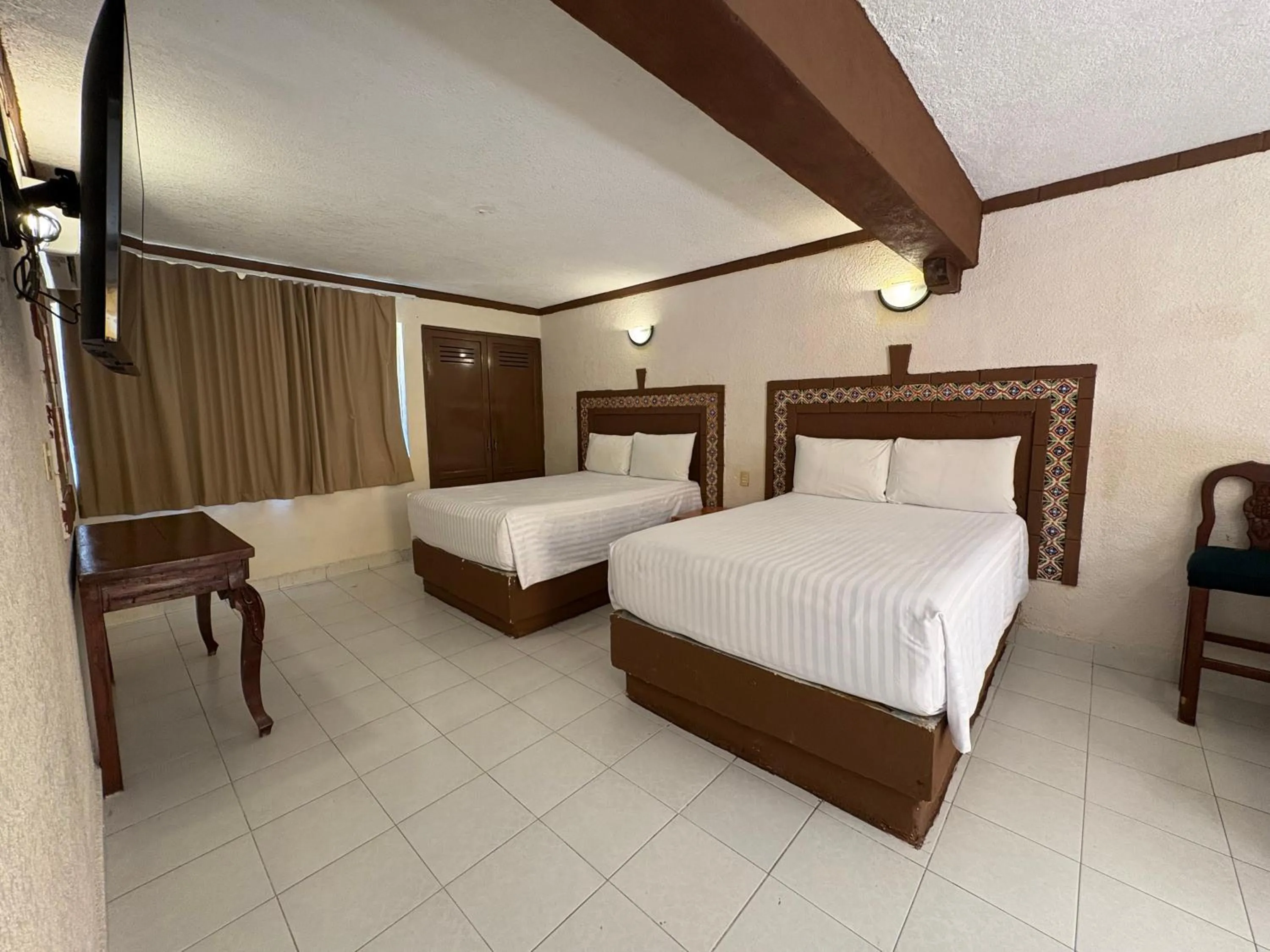 Bed in Suites Cancun Center