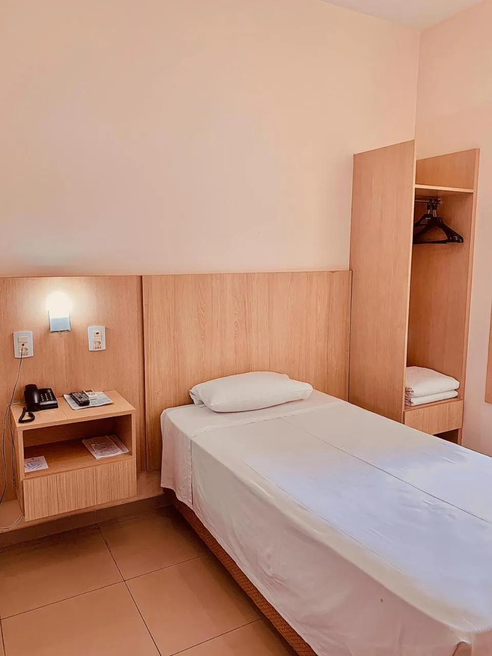 Bed in Victoria Plaza Hotel