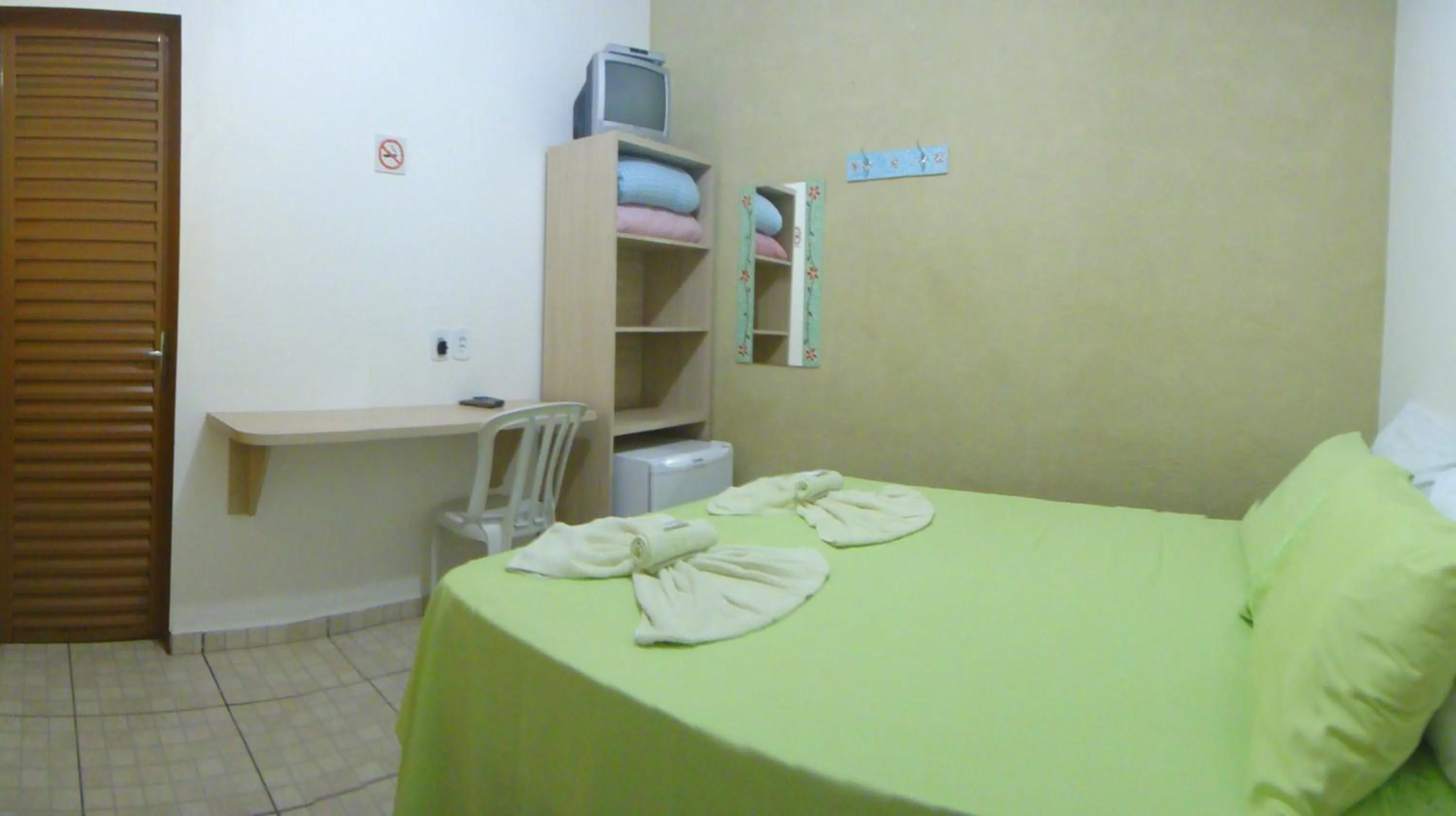 Bed in Pousada Jubaia