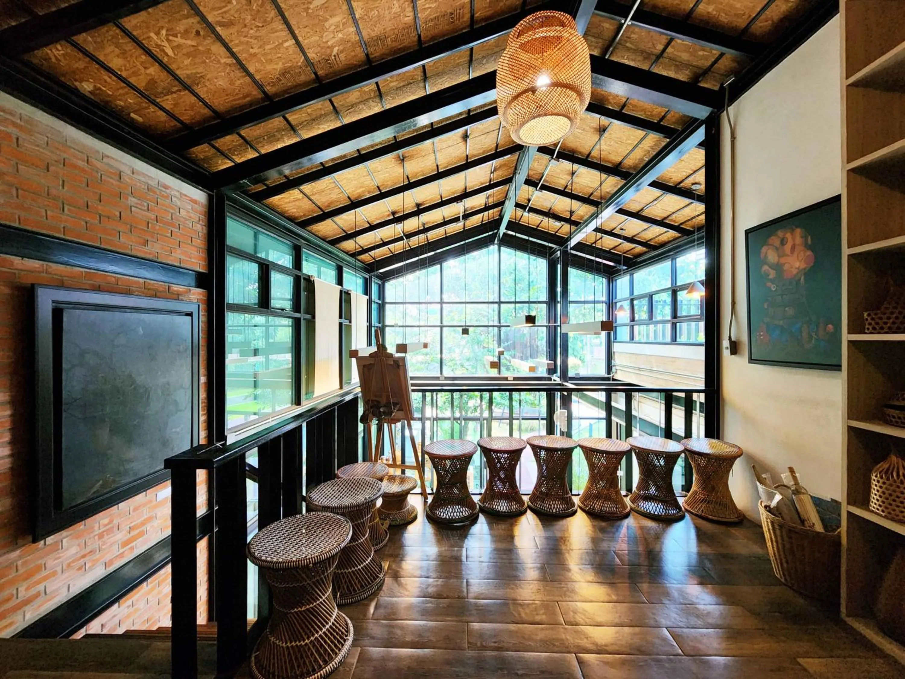 Seating area in Baan Mai Kradan Hostel Chiang Rai