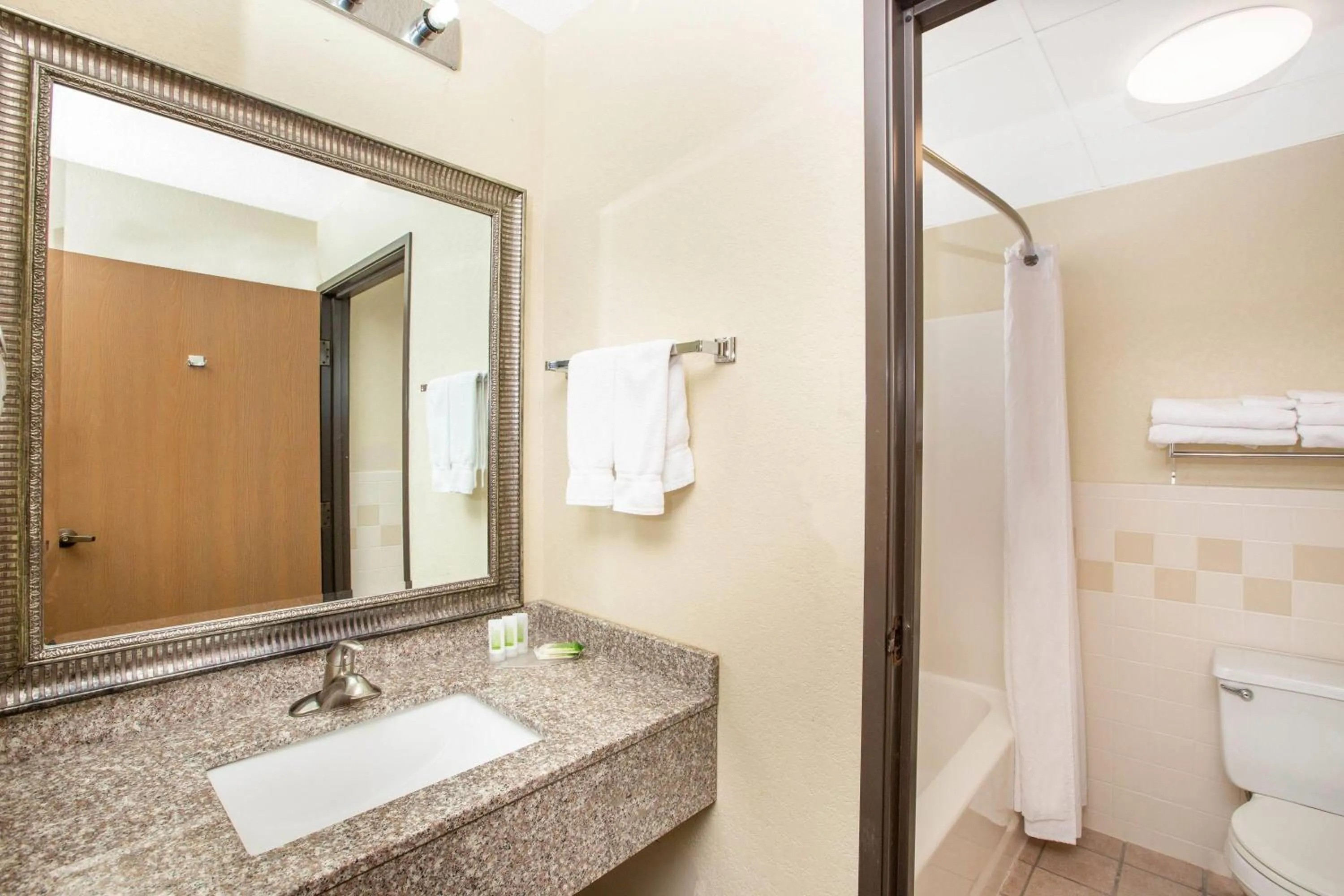 Bathroom in AmericInn by Wyndham Lincoln North