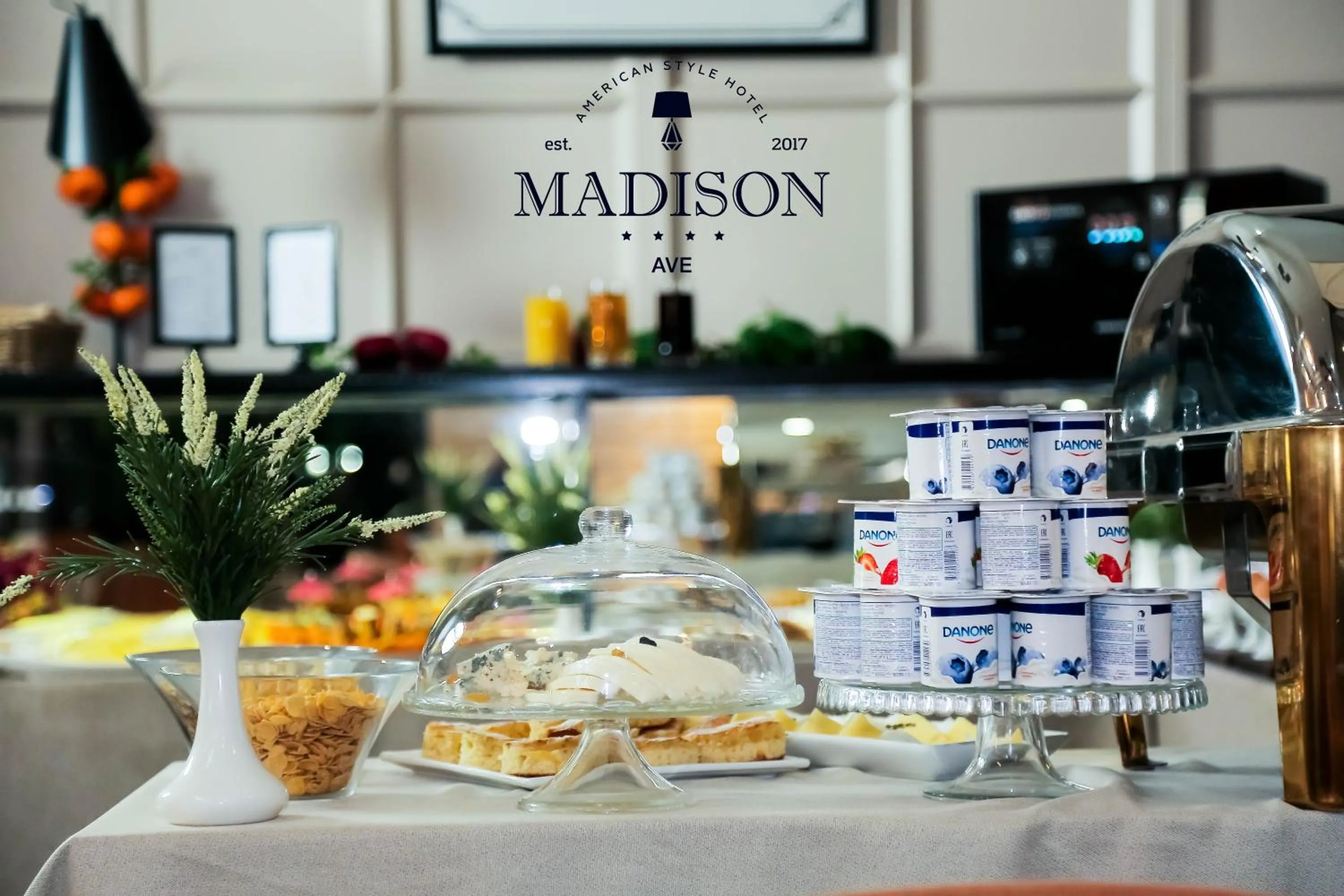 Property logo or sign in Madison Ave Hotel Bishkek