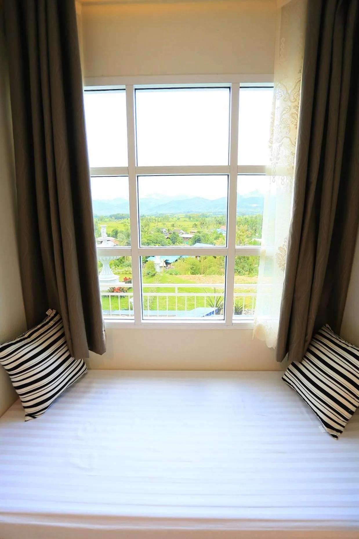 Bed in Pua De View Boutique Resort