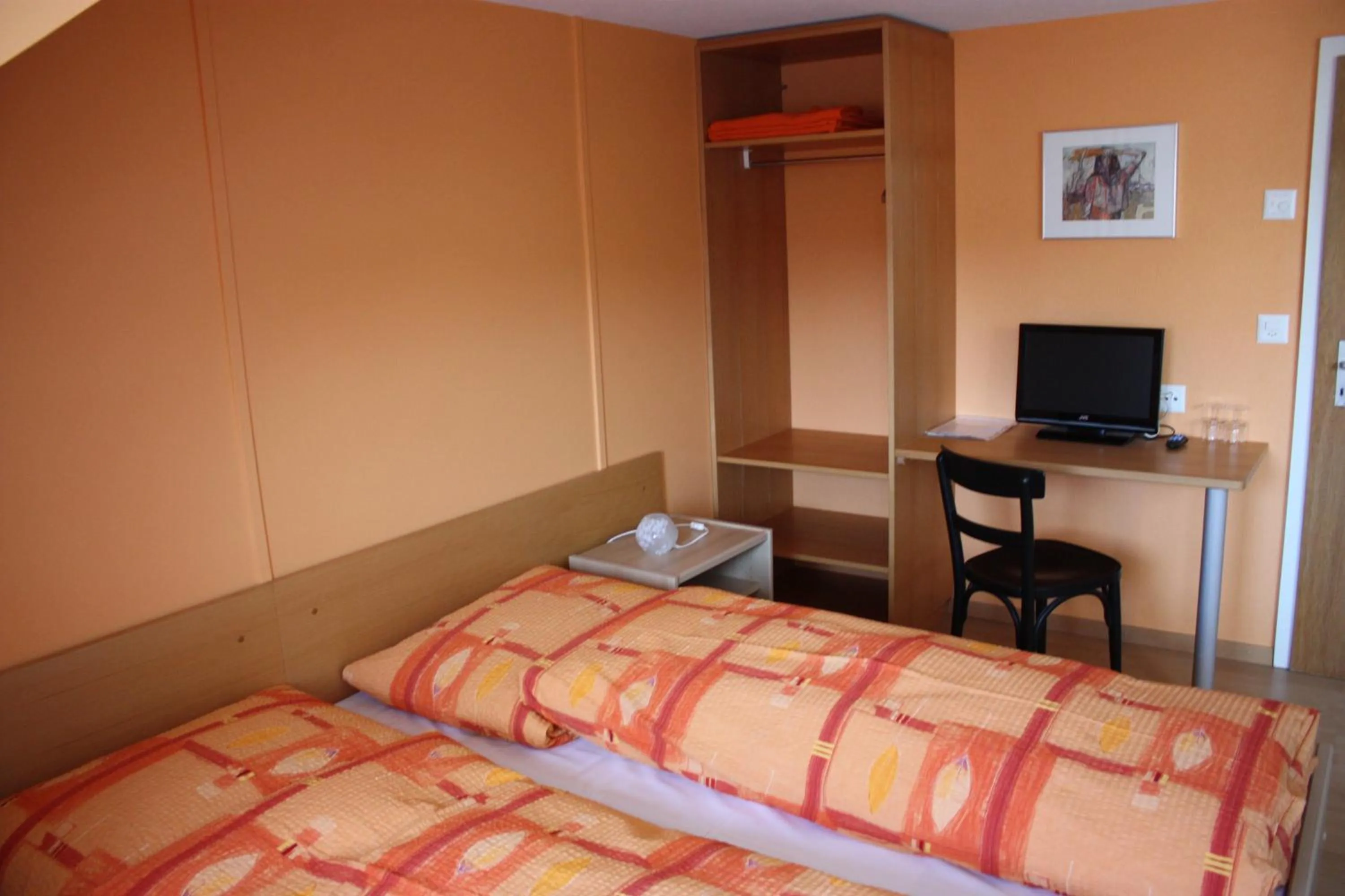 Bed in Hotel Koi-Gartenteich