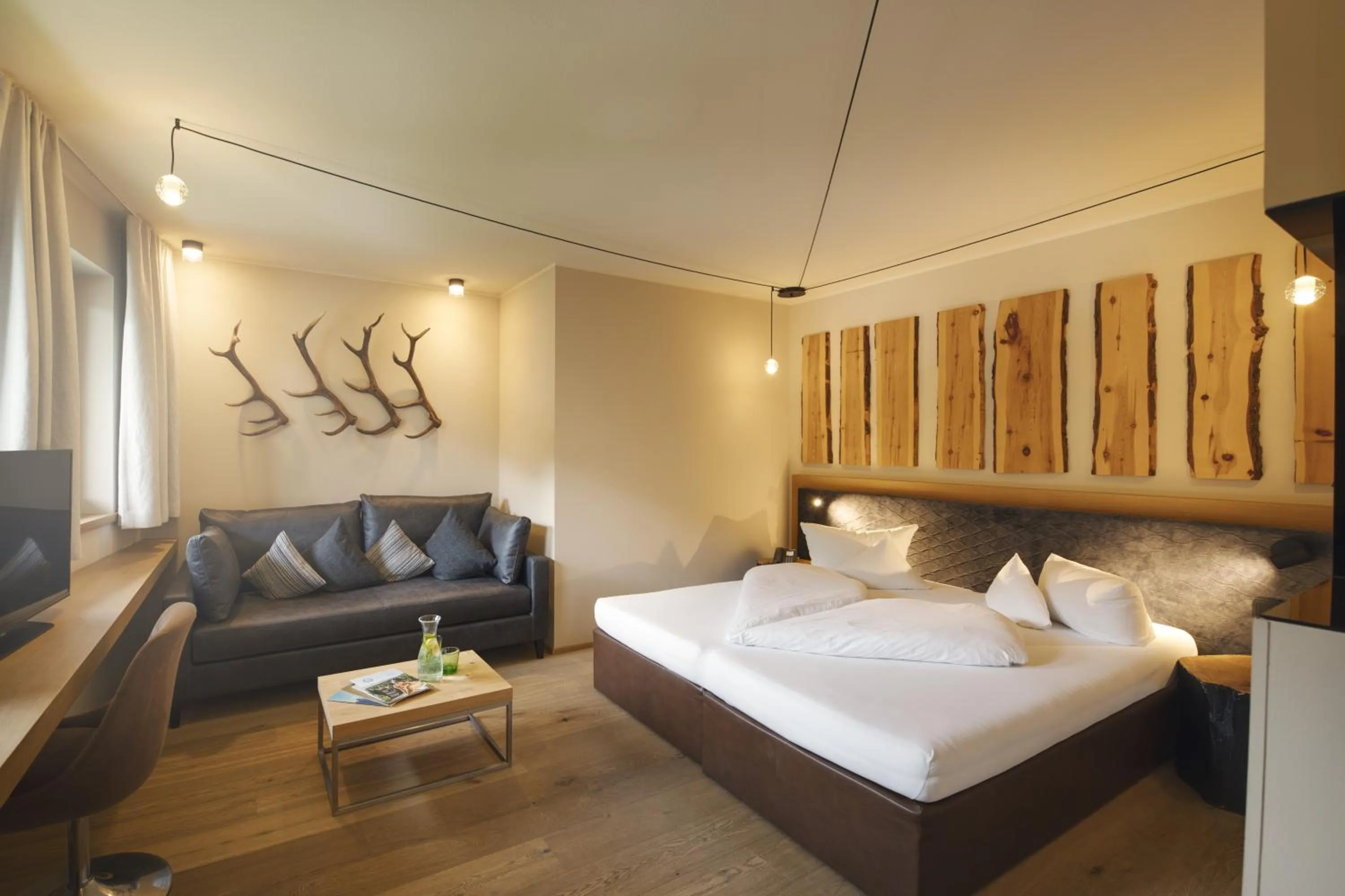 Living room, Bed in Almhof Family und Wellness Resort