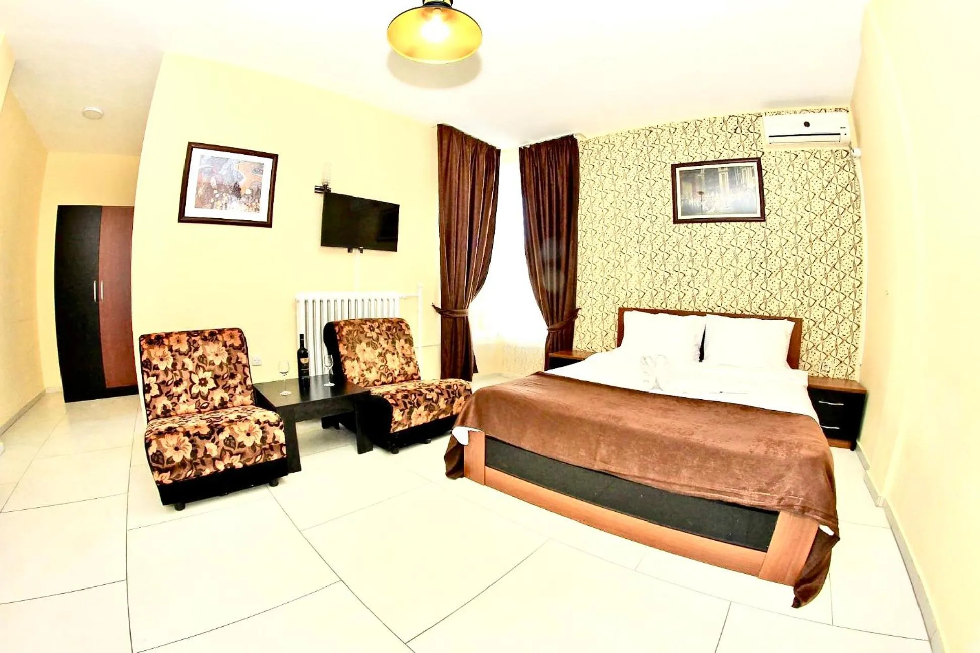 Communal lounge/ TV room, Bed in Hotel Lagadin