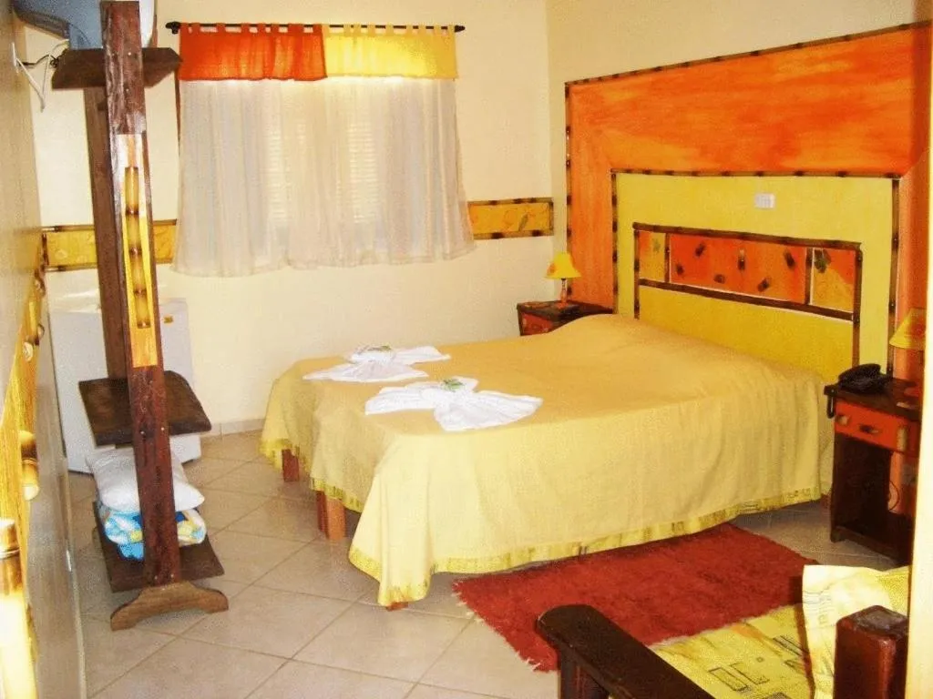 Photo of the whole room, Bed in Peruíbe Suíte Flat Hotel