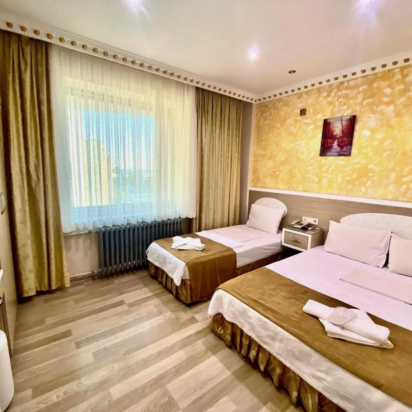 Bed in Grand Oral Hotel