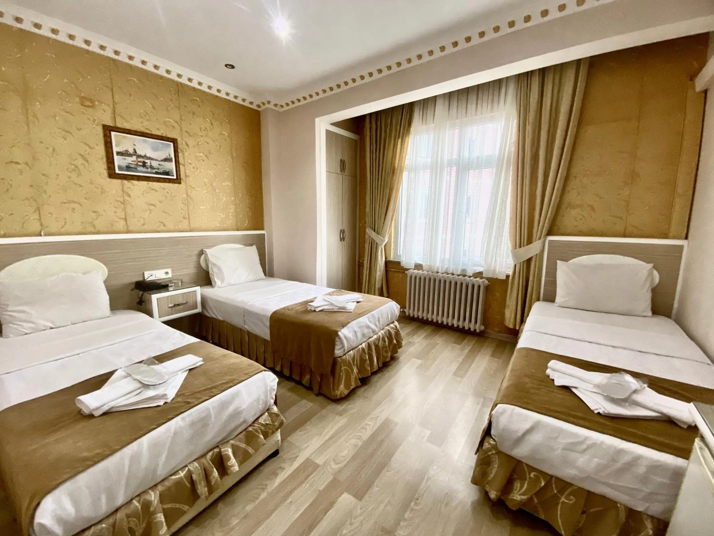 Bed in Grand Oral Hotel