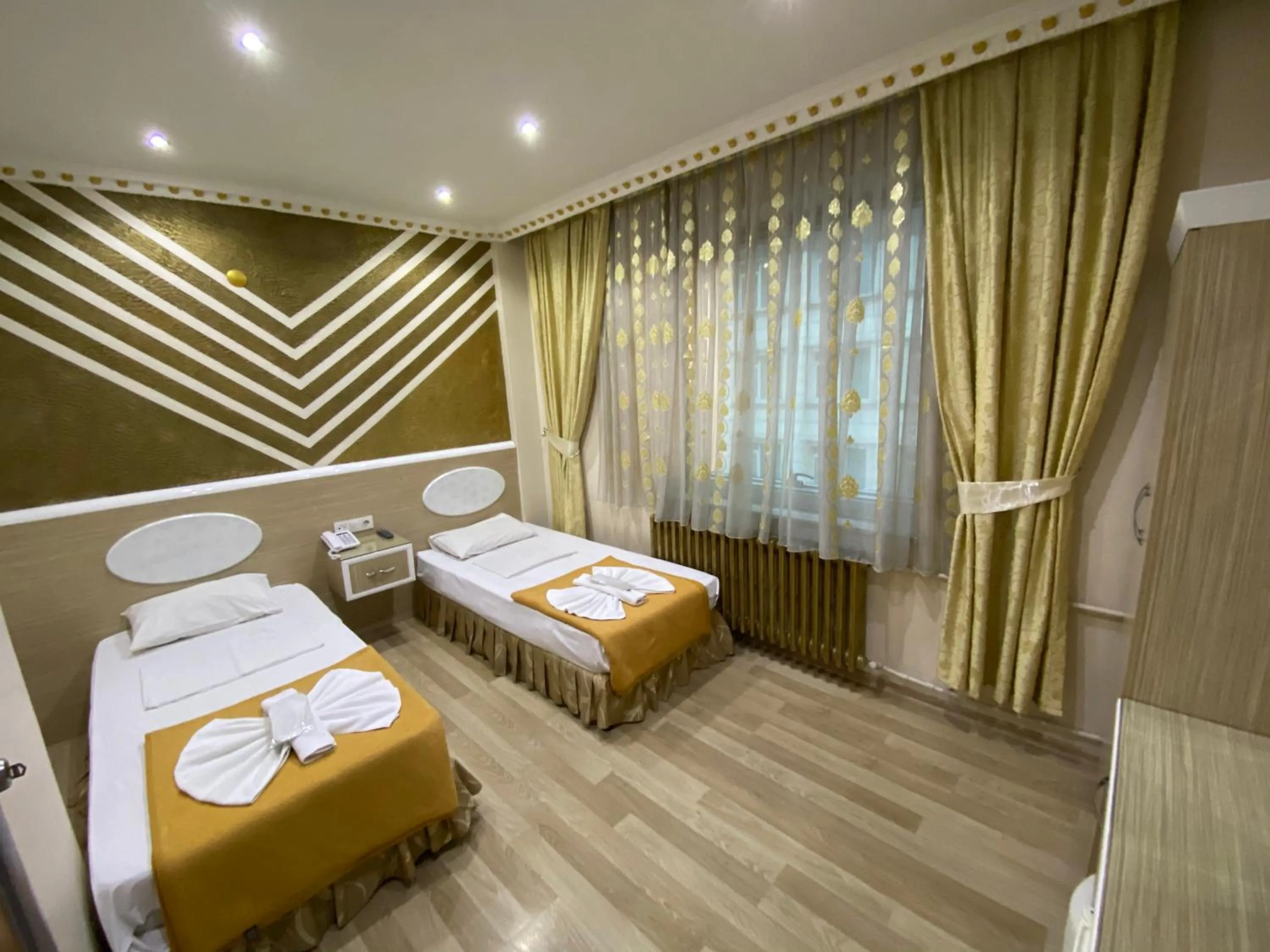 Bed in Grand Oral Hotel