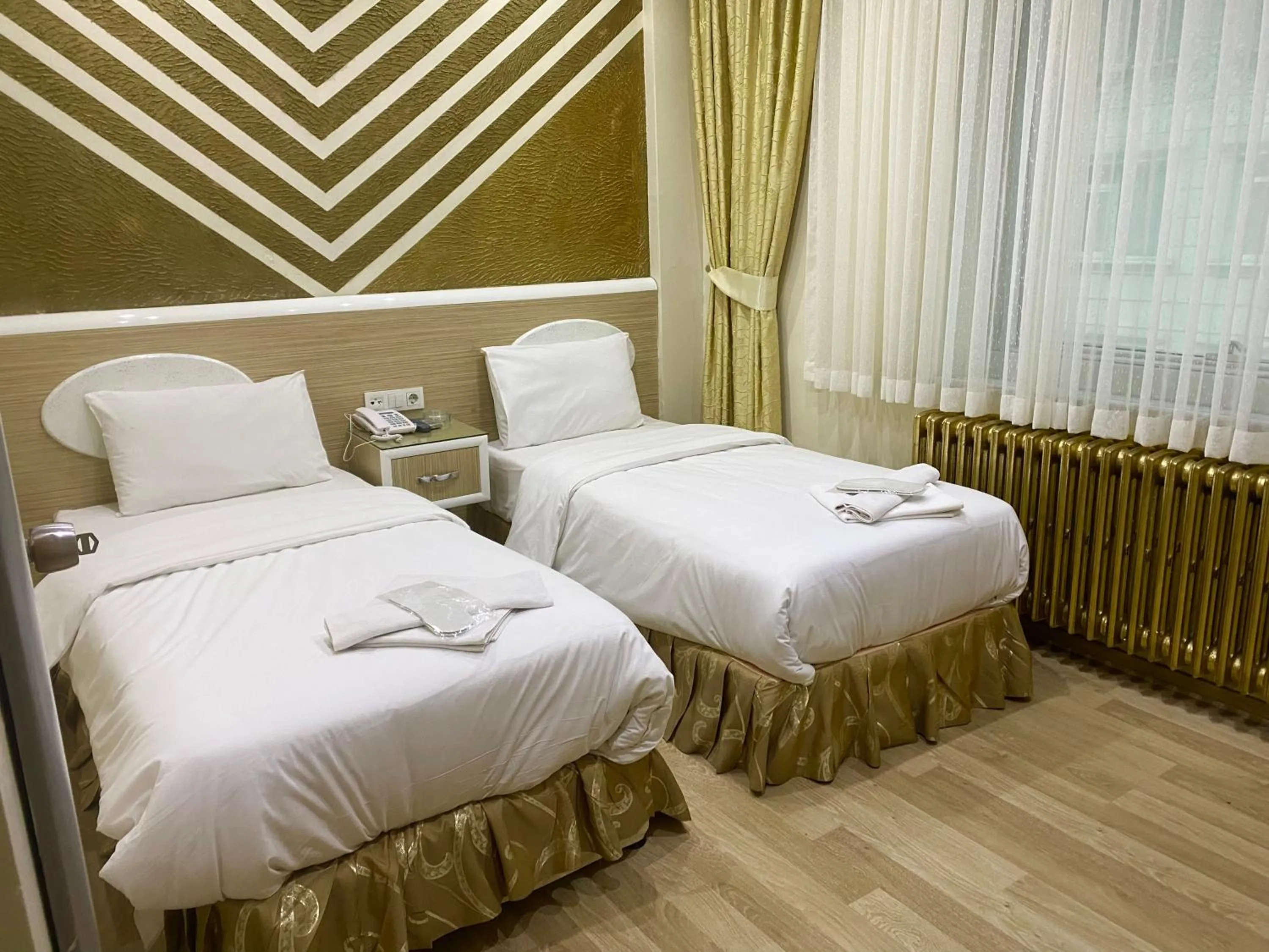 Bed in Grand Oral Hotel
