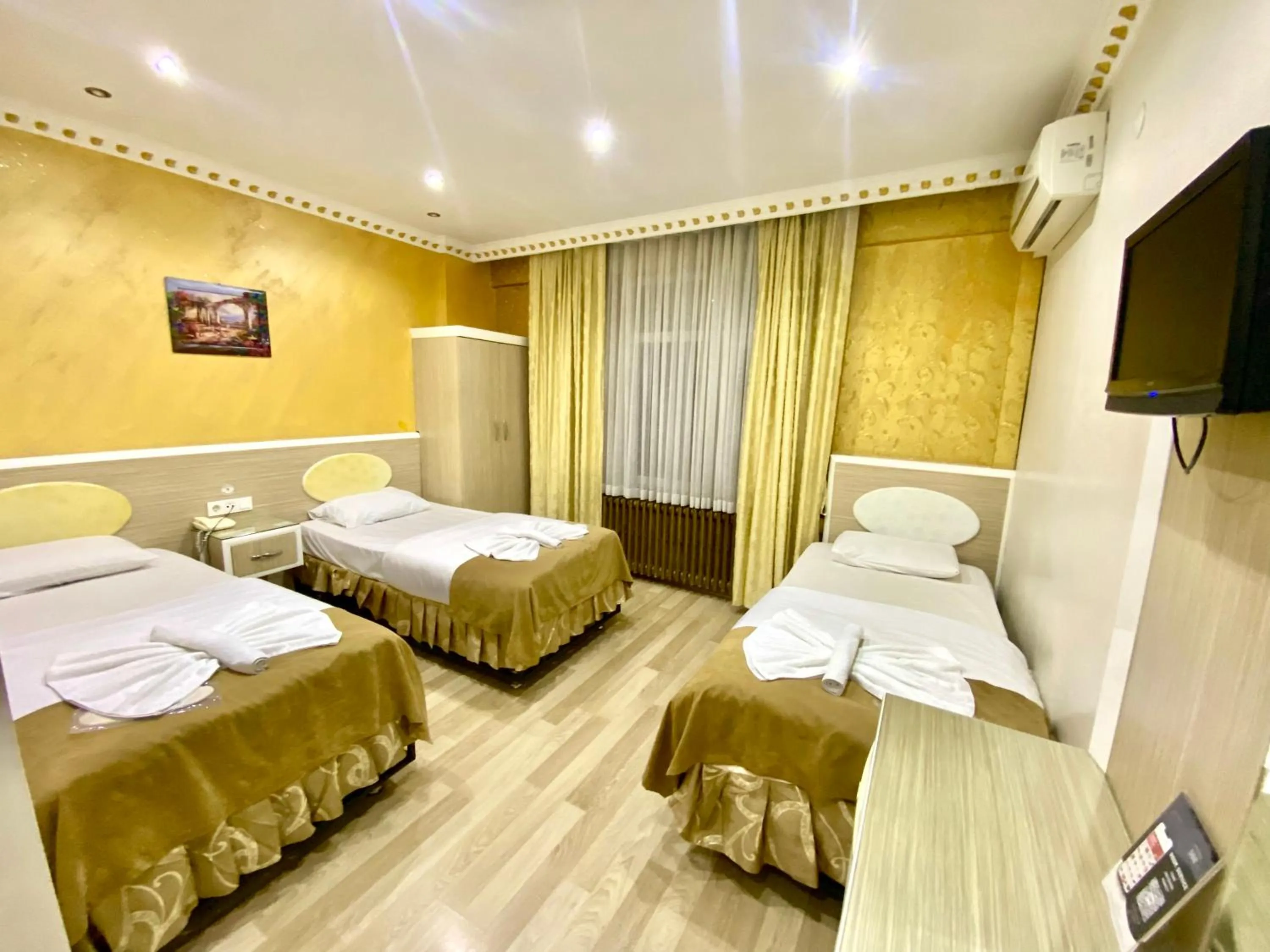 Bed in Grand Oral Hotel