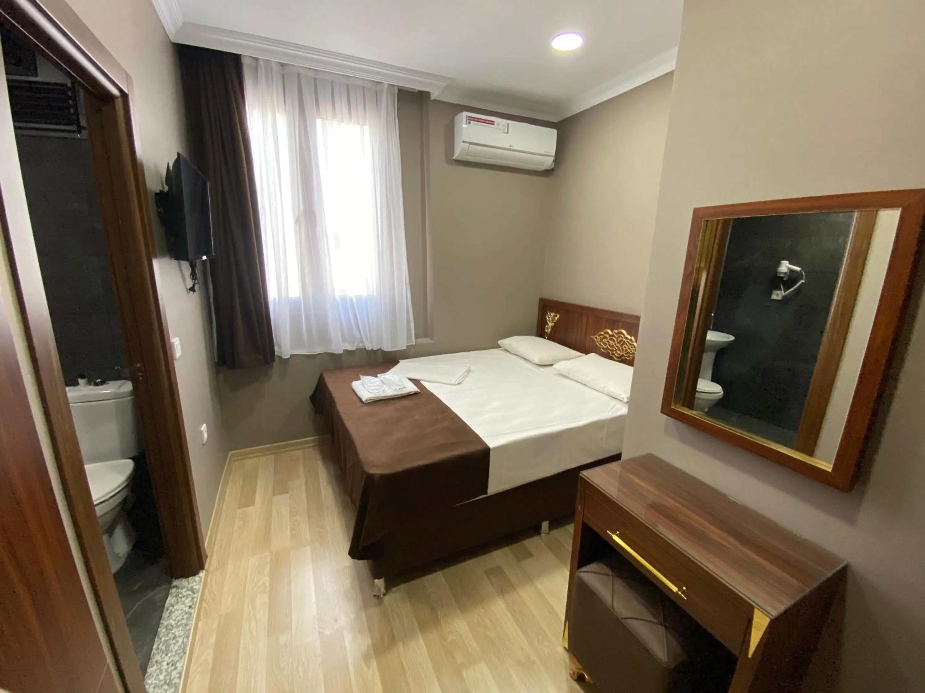 Bed in Grand Oral Hotel