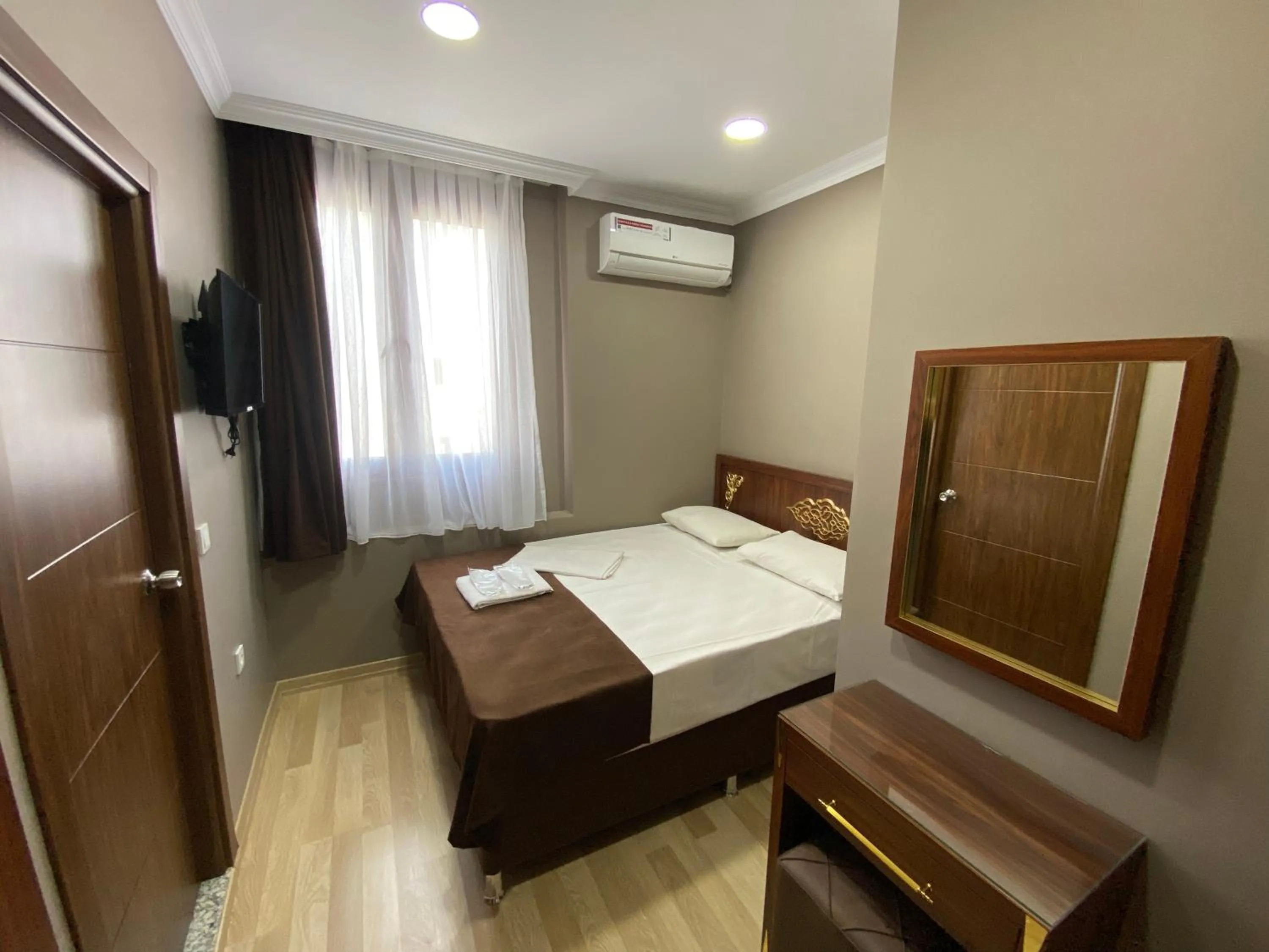 Bed in Grand Oral Hotel