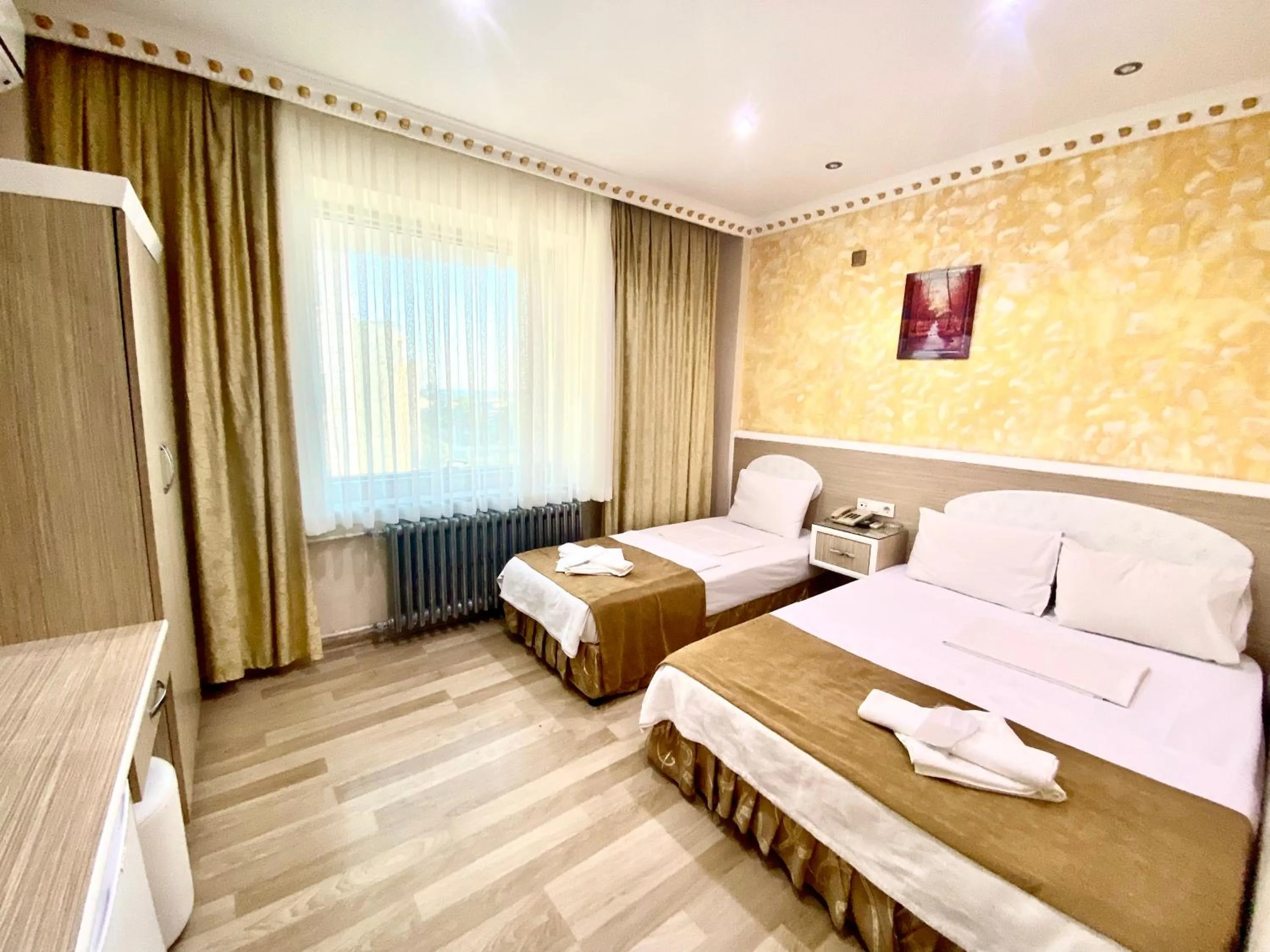 Bed in Grand Oral Hotel