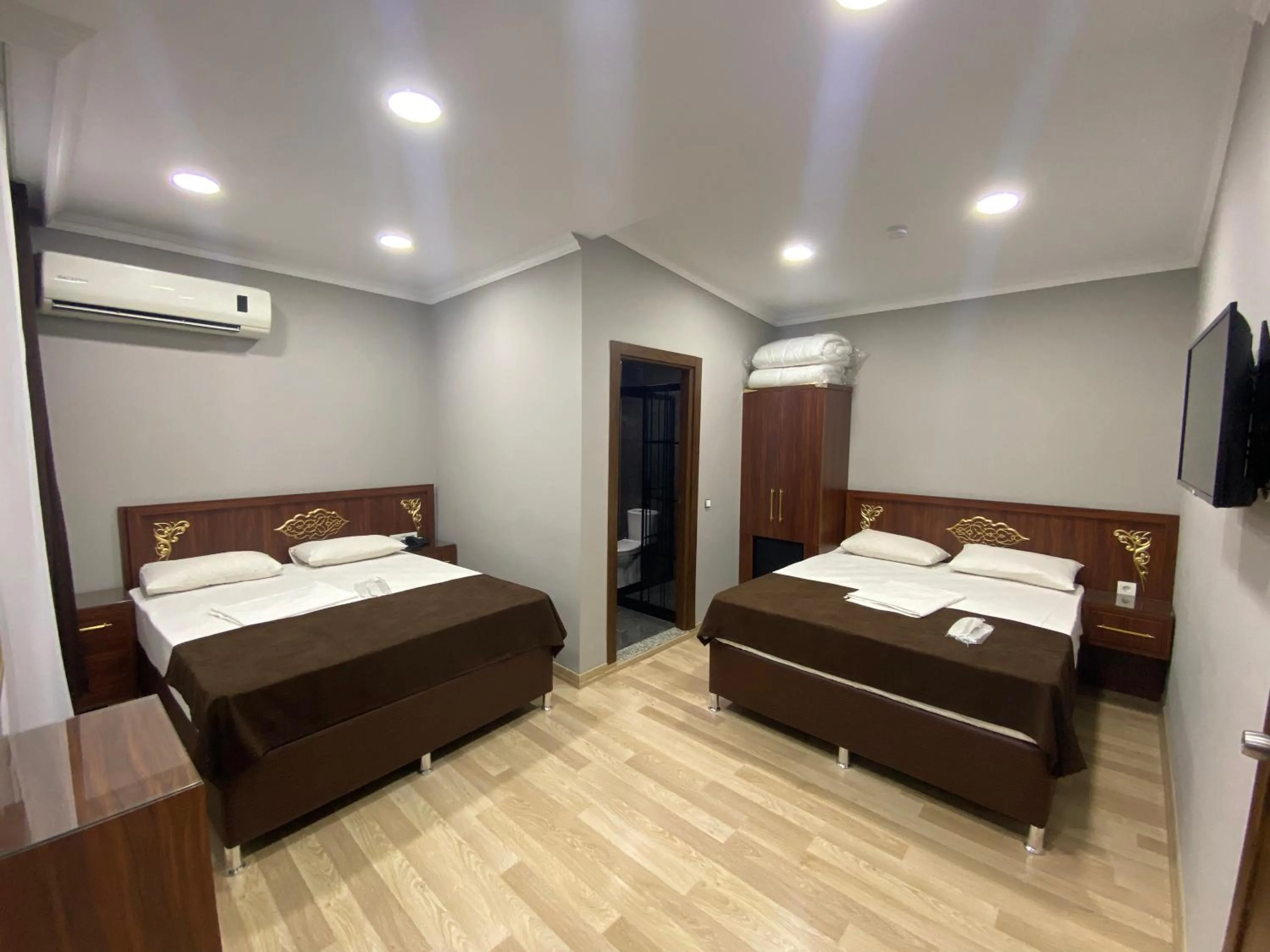 Bed in Grand Oral Hotel