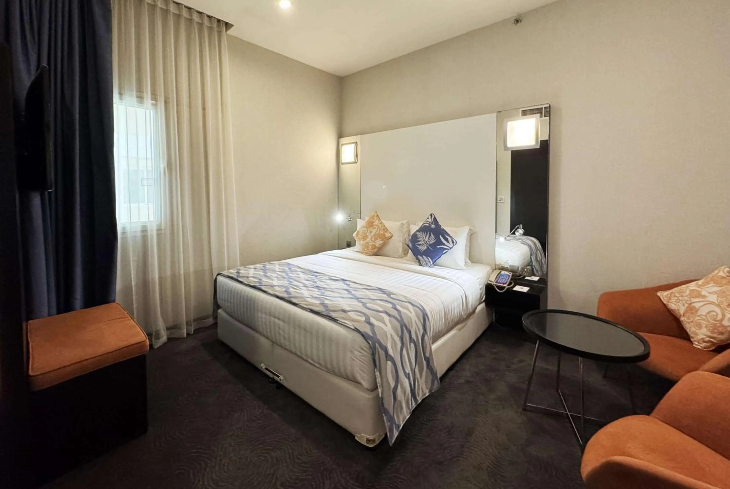 Photo of the whole room, Bed in Ramada Encore Doha by Wyndham