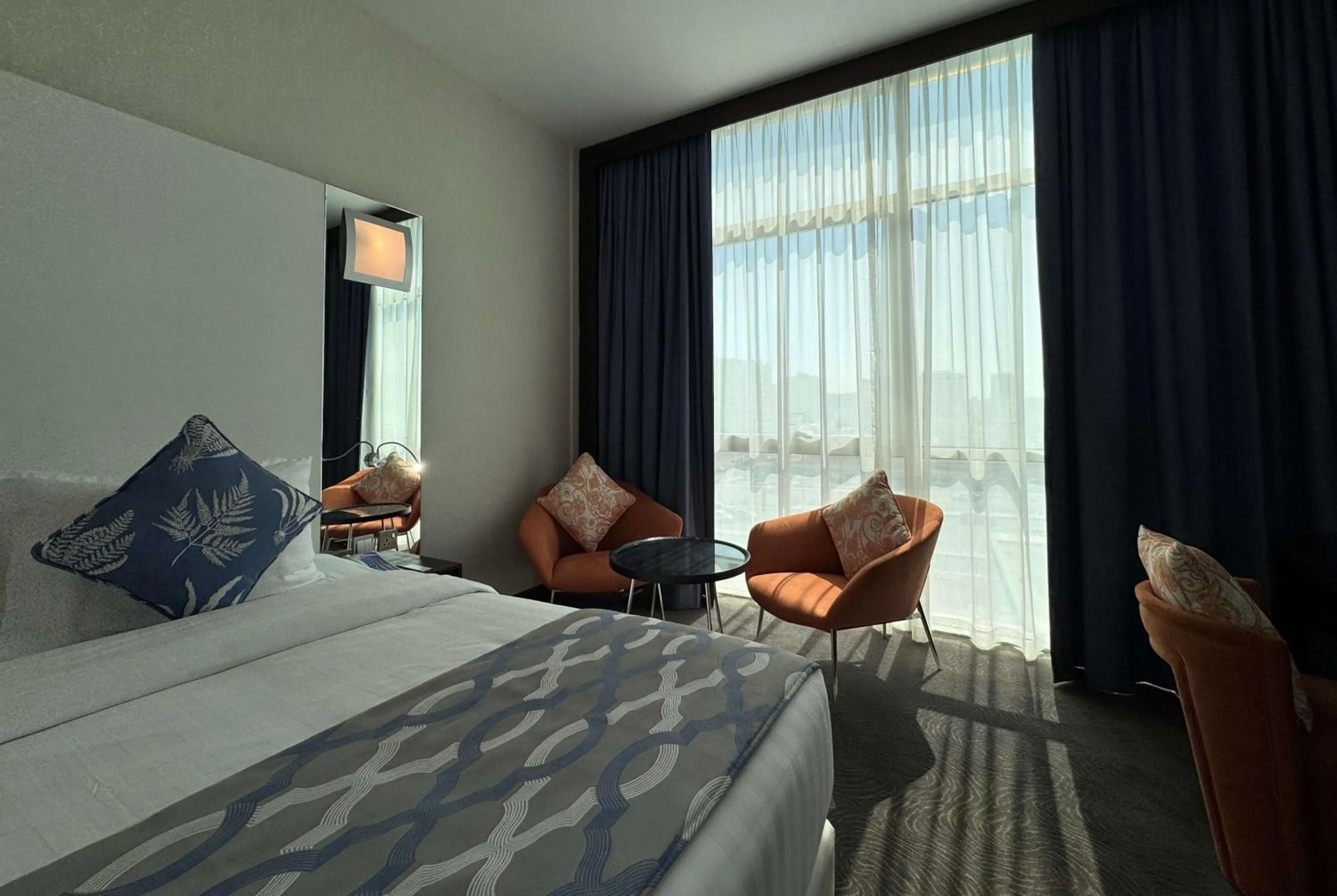 Photo of the whole room, Bed in Ramada Encore Doha by Wyndham