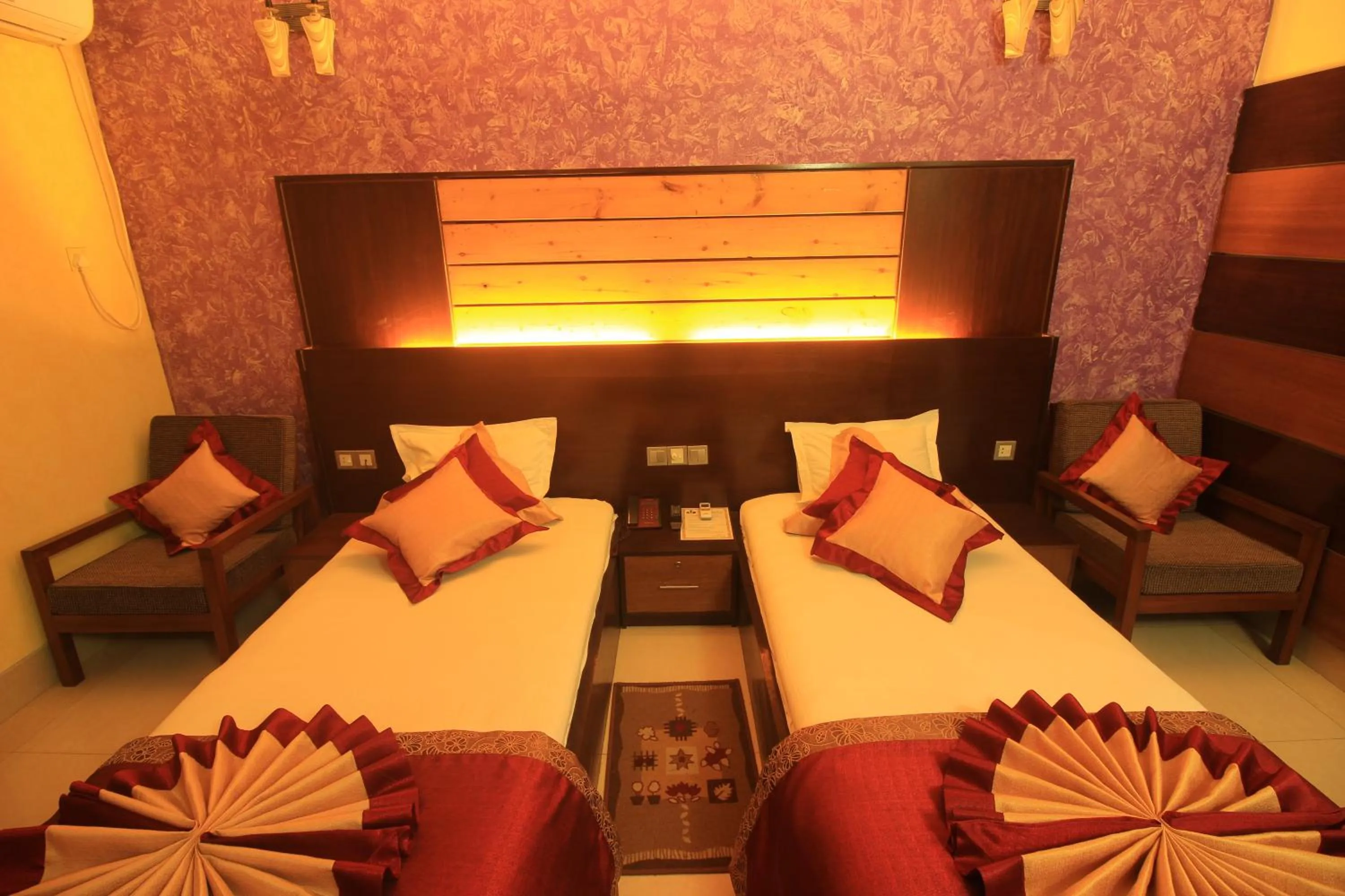 Bed in Tiger Garden Int Hotel