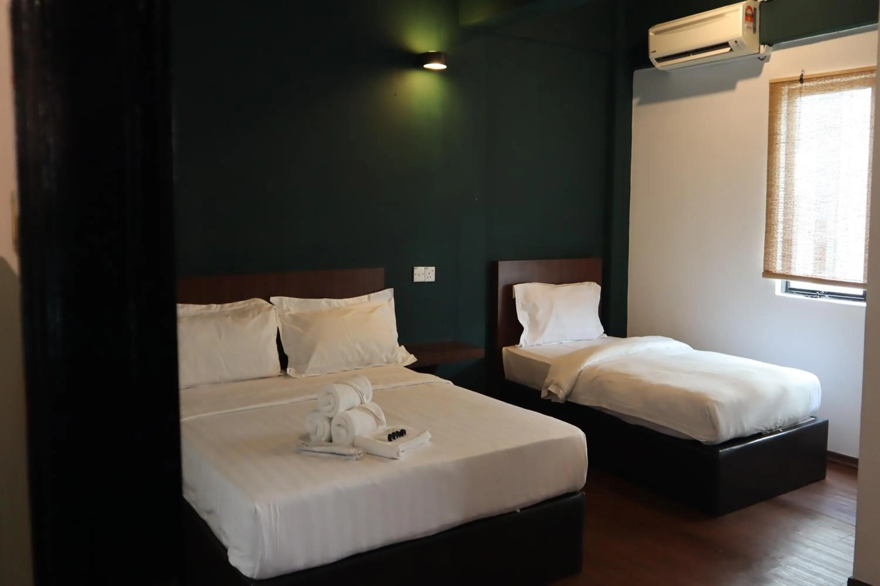 Bed in Room V at Kluang Parade Near Bus Stop Kluang