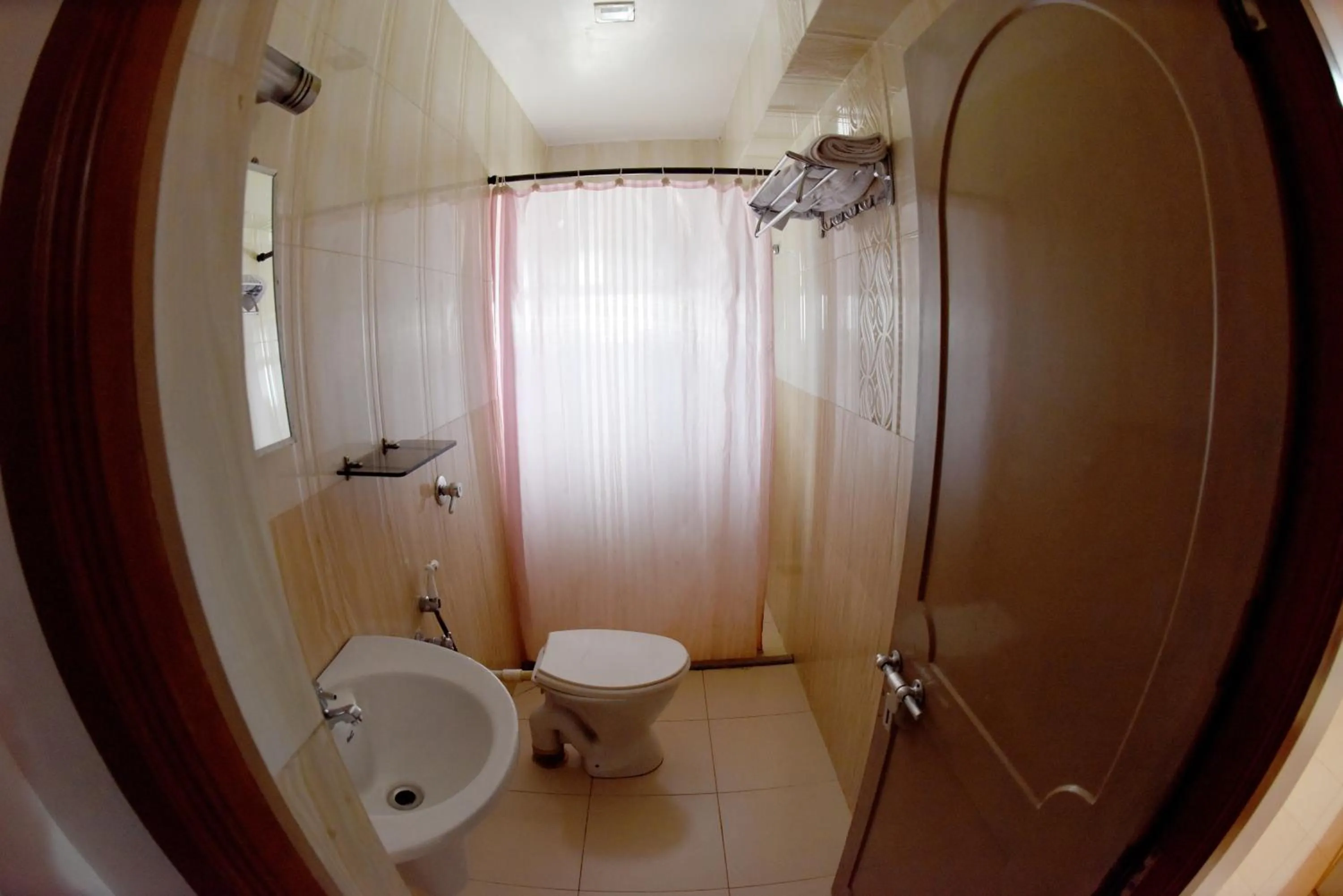 Bathroom in Hotel Sharada International