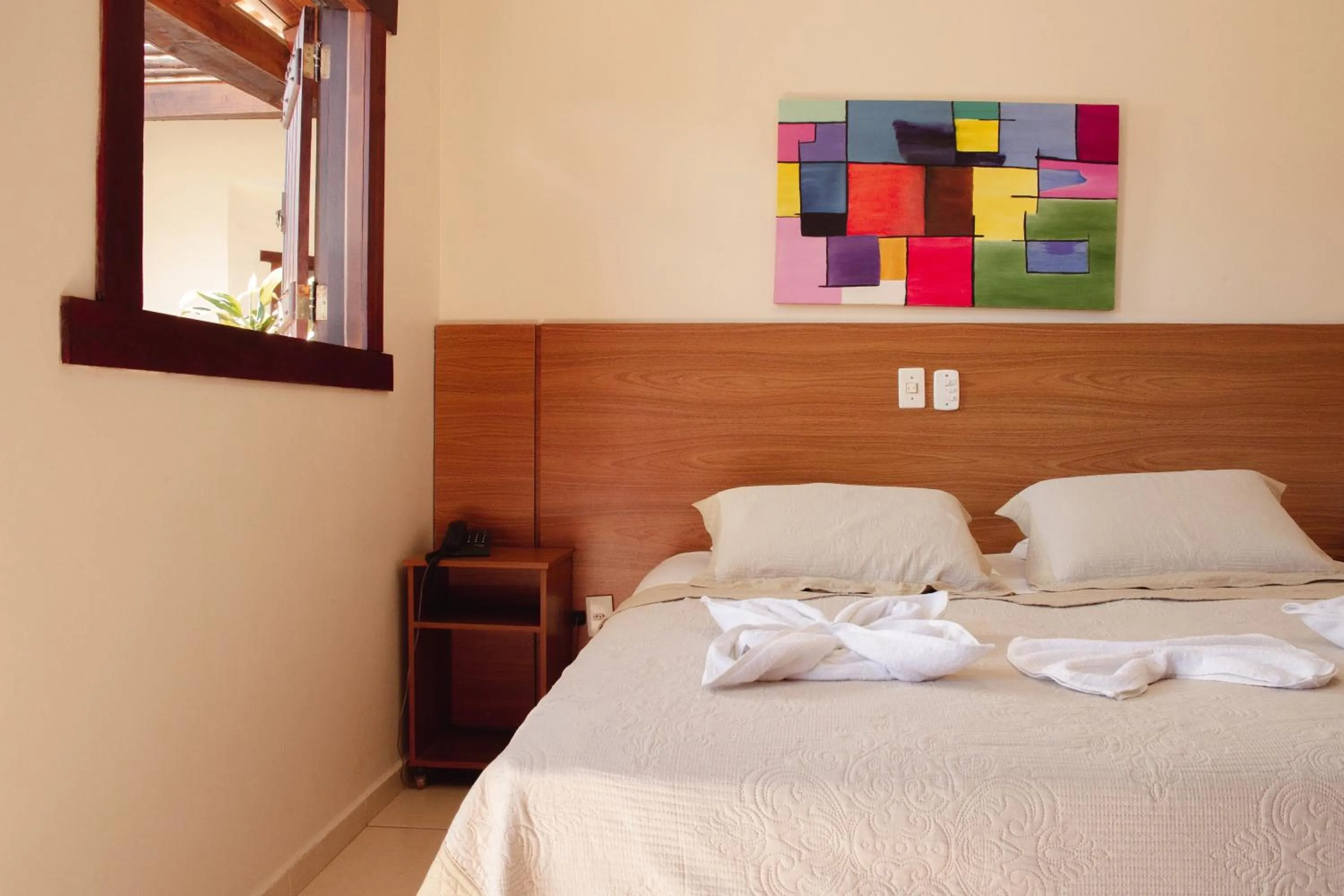 Bed in Pousada Chamamé