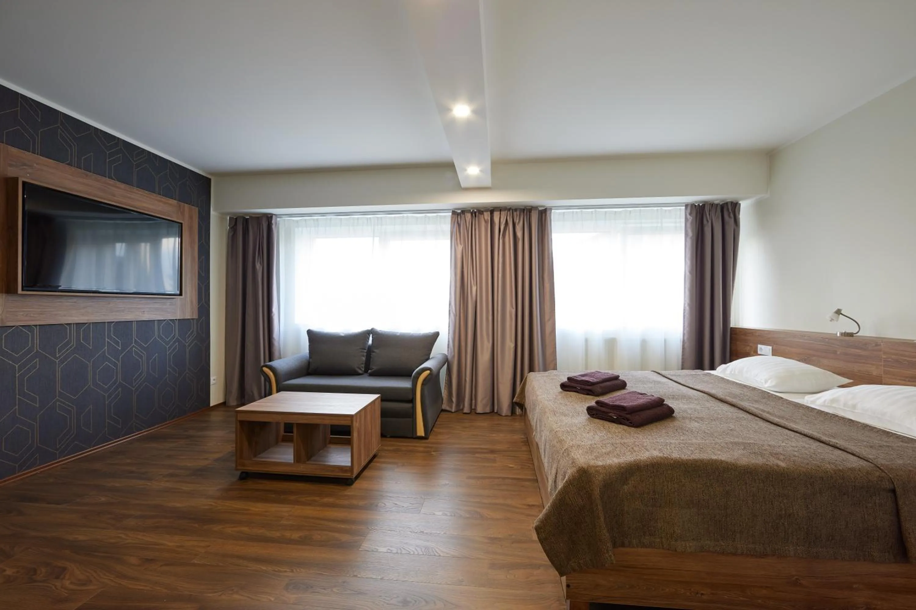 Communal lounge/ TV room, Bed in Hotell Wesenbergh