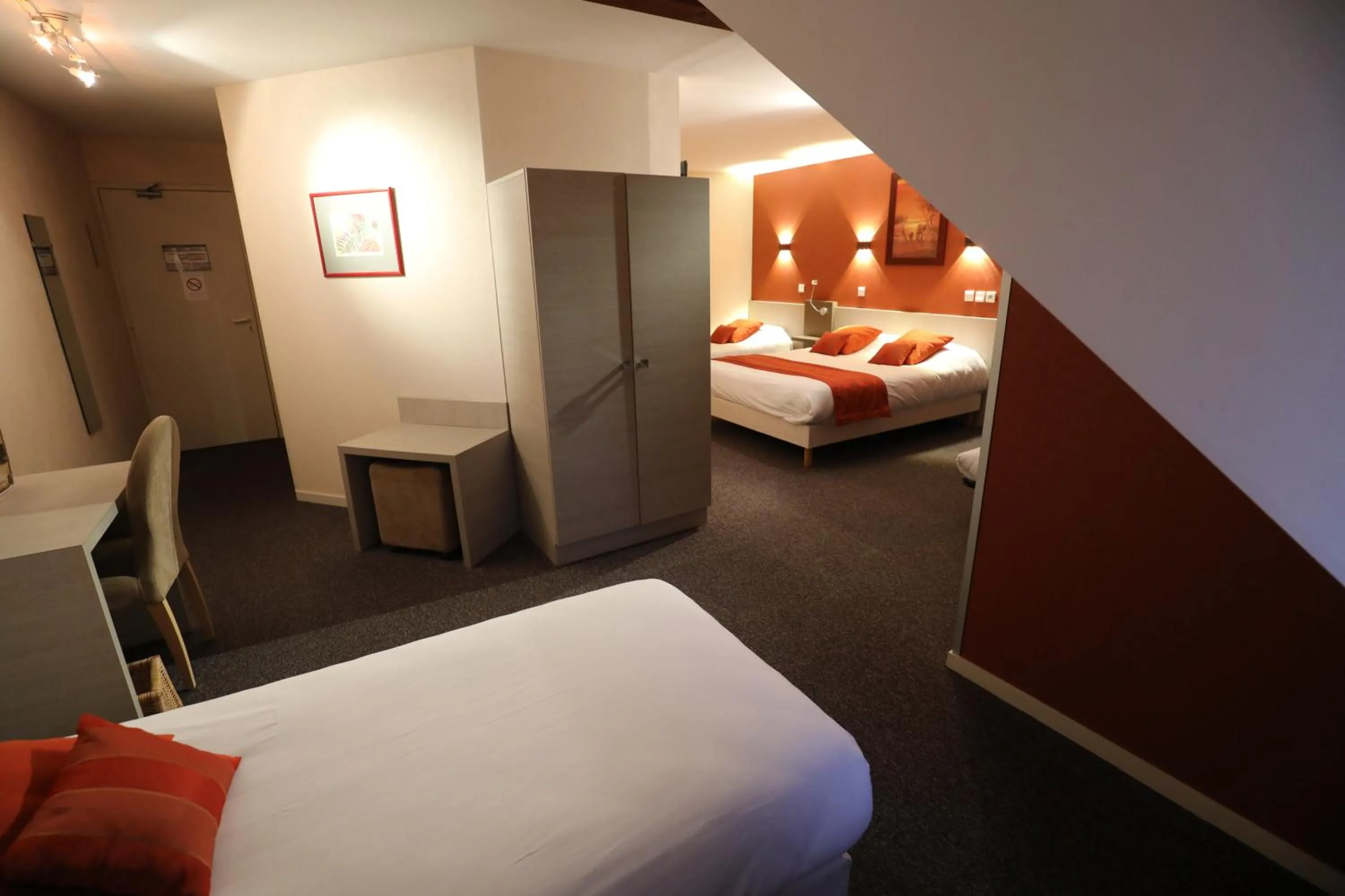 Bed in Logis Le Bourguignon