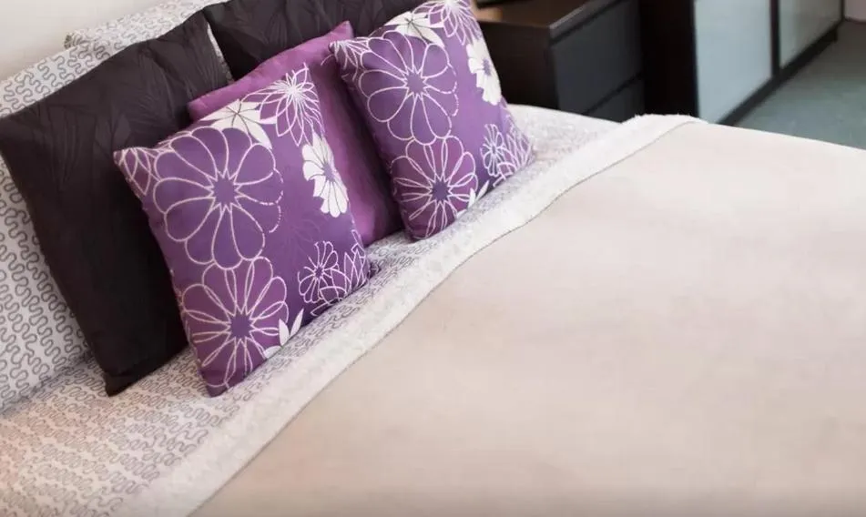 Bed in Home2Home-Rooms