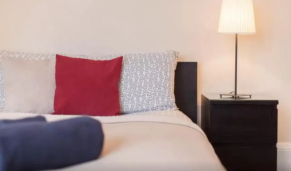 Bed in Home2Home-Rooms