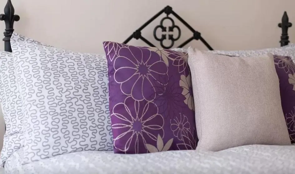 Bed in Home2Home-Rooms