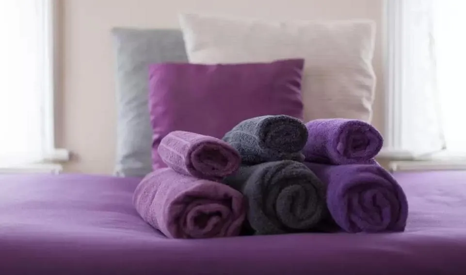 Bed in Home2Home-Rooms