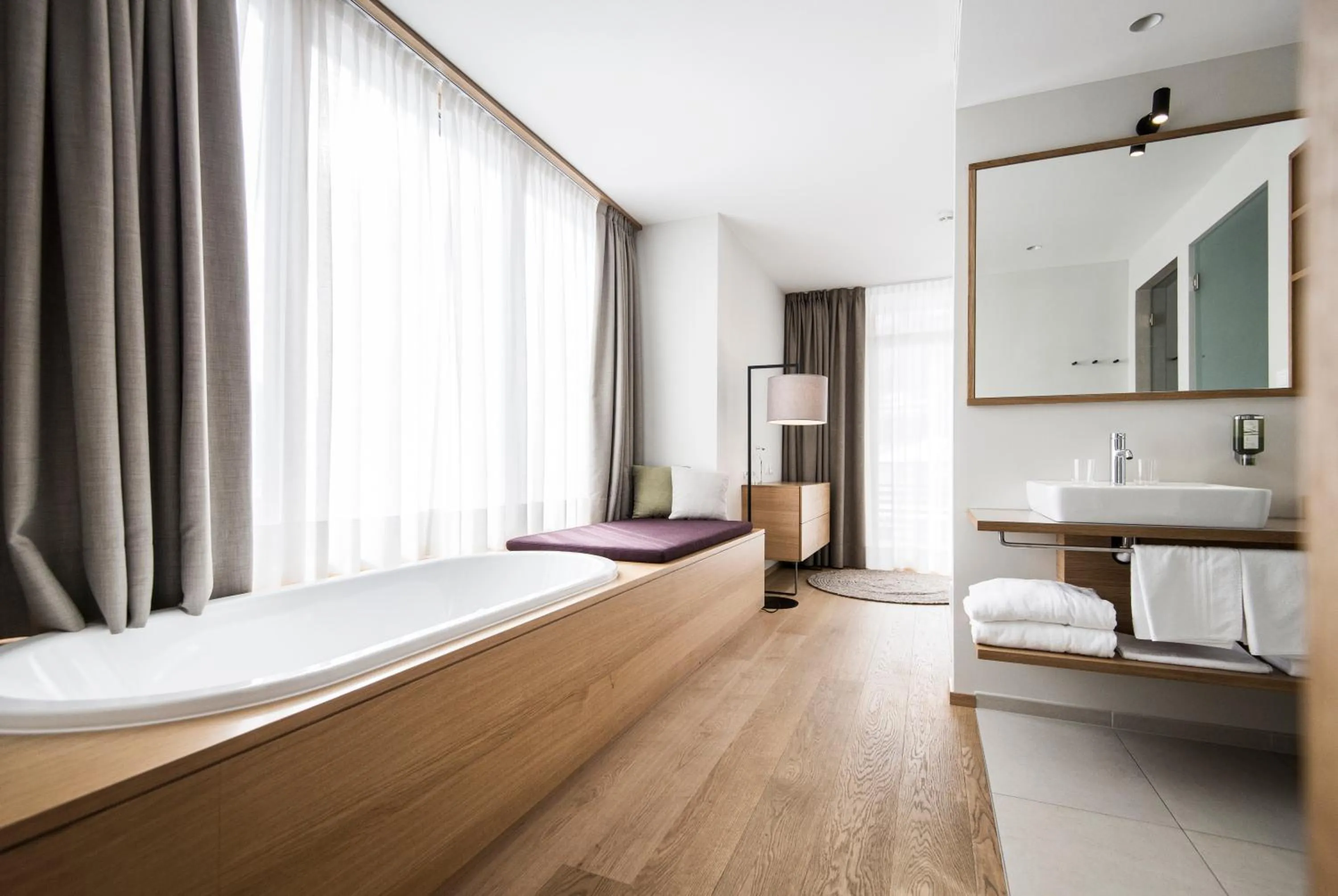 Bathroom, Bed in Hotel Schwarzschmied, a Member of Design Hotels